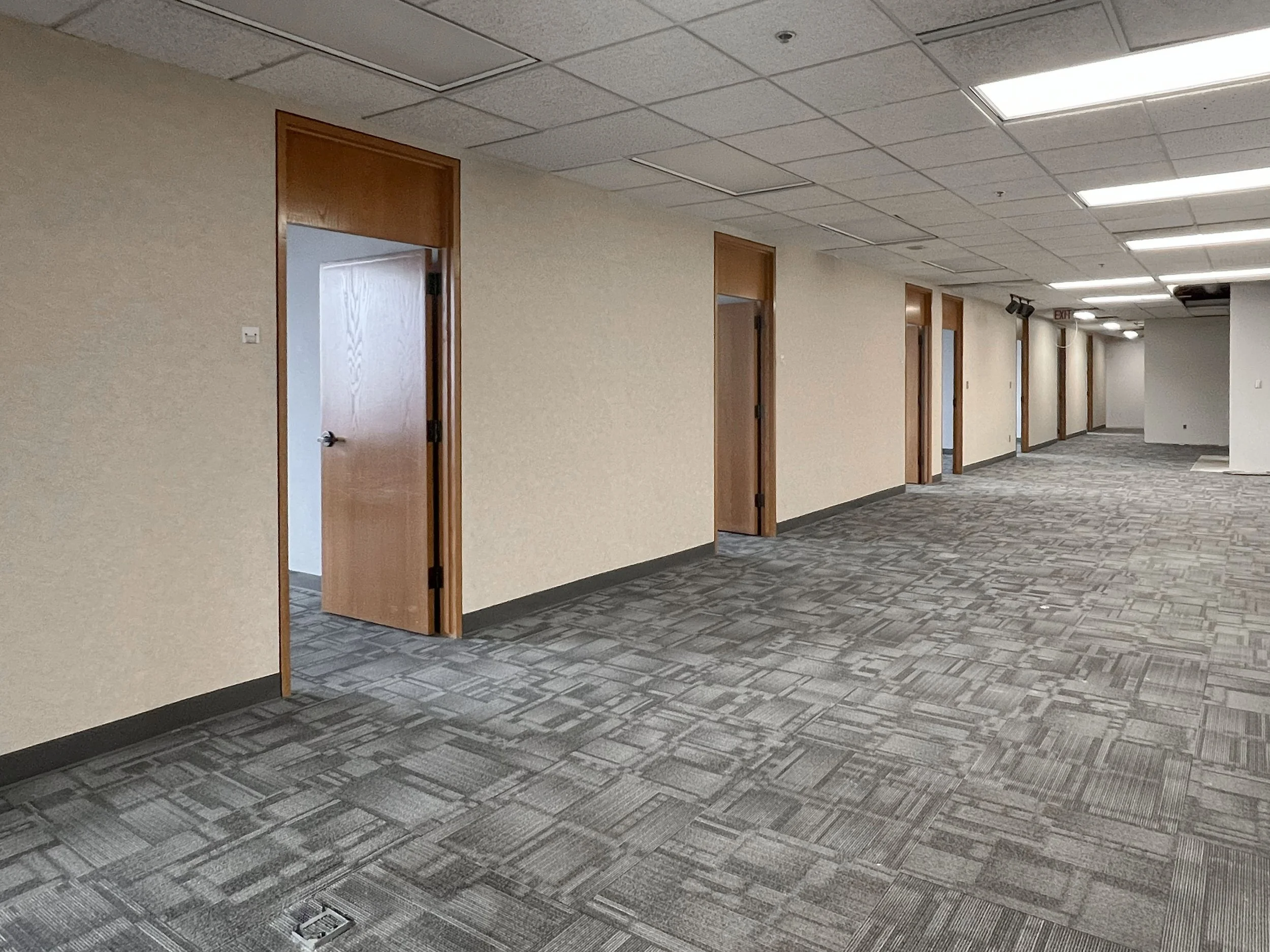 Open office area with private offices in Suite 1010 at 99 Monroe