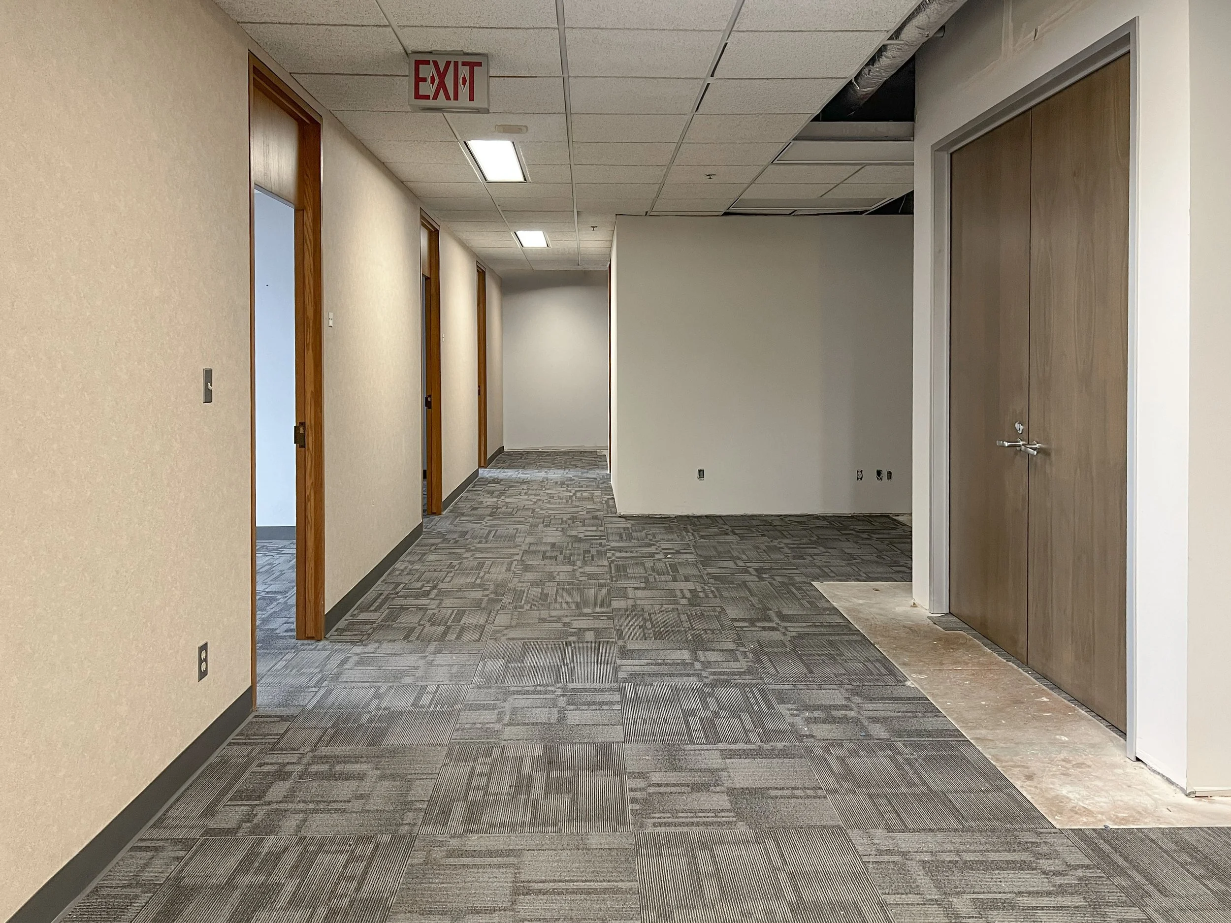 Office corridor and workspace in Suite 1010 at 99 Monroe
