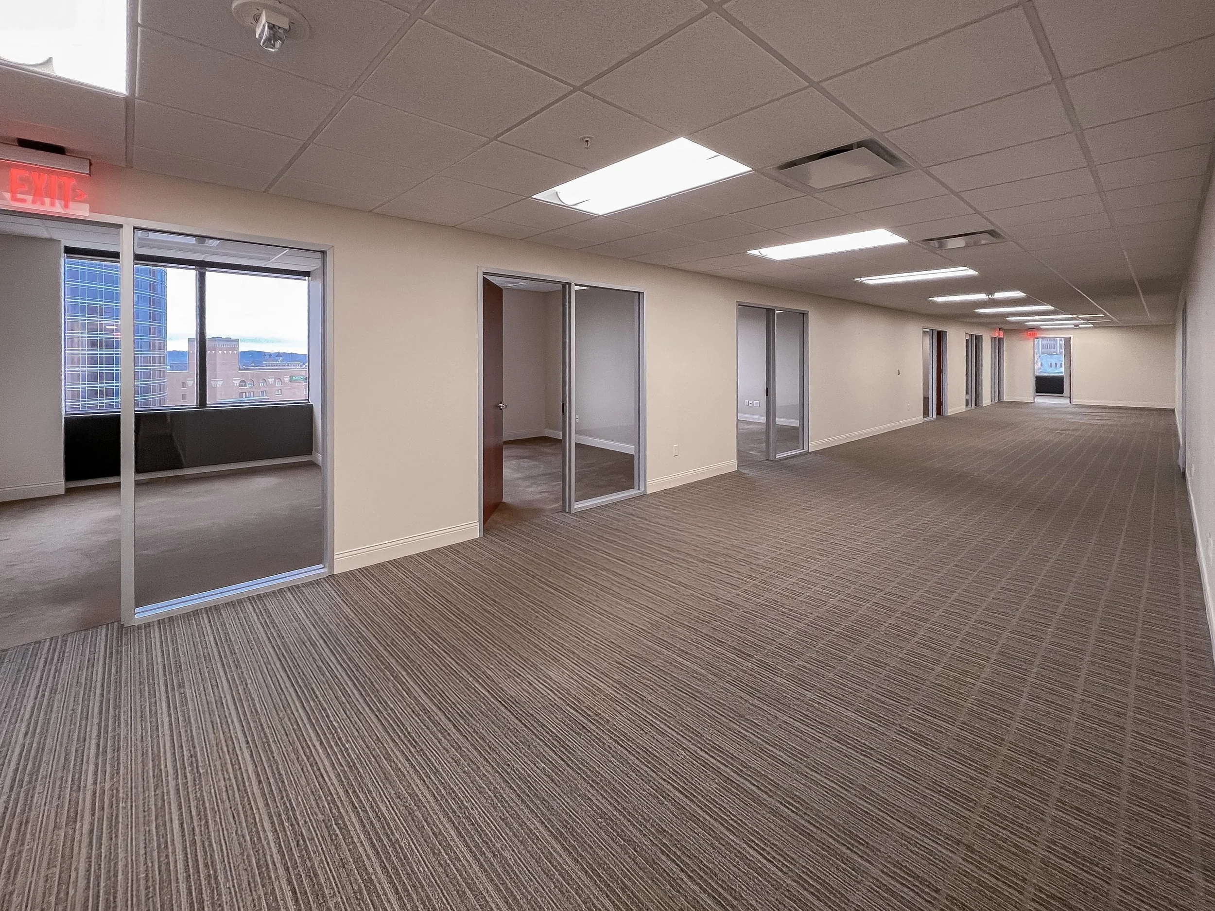 Open office area with private offices in Suite 850 at 99 Monroe