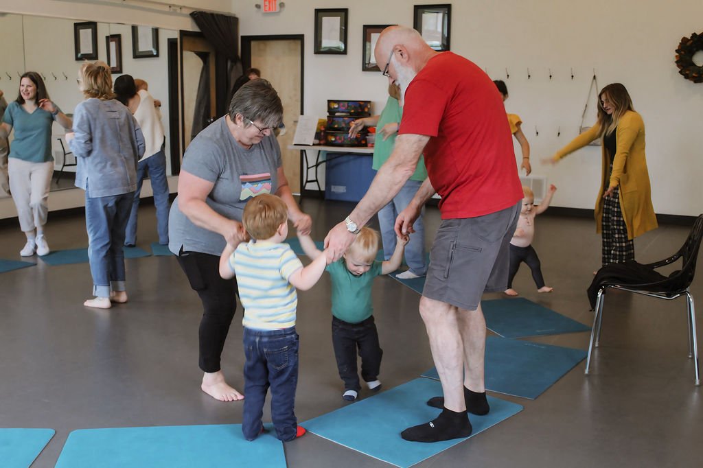 grandparents dancing with grandkids in music class