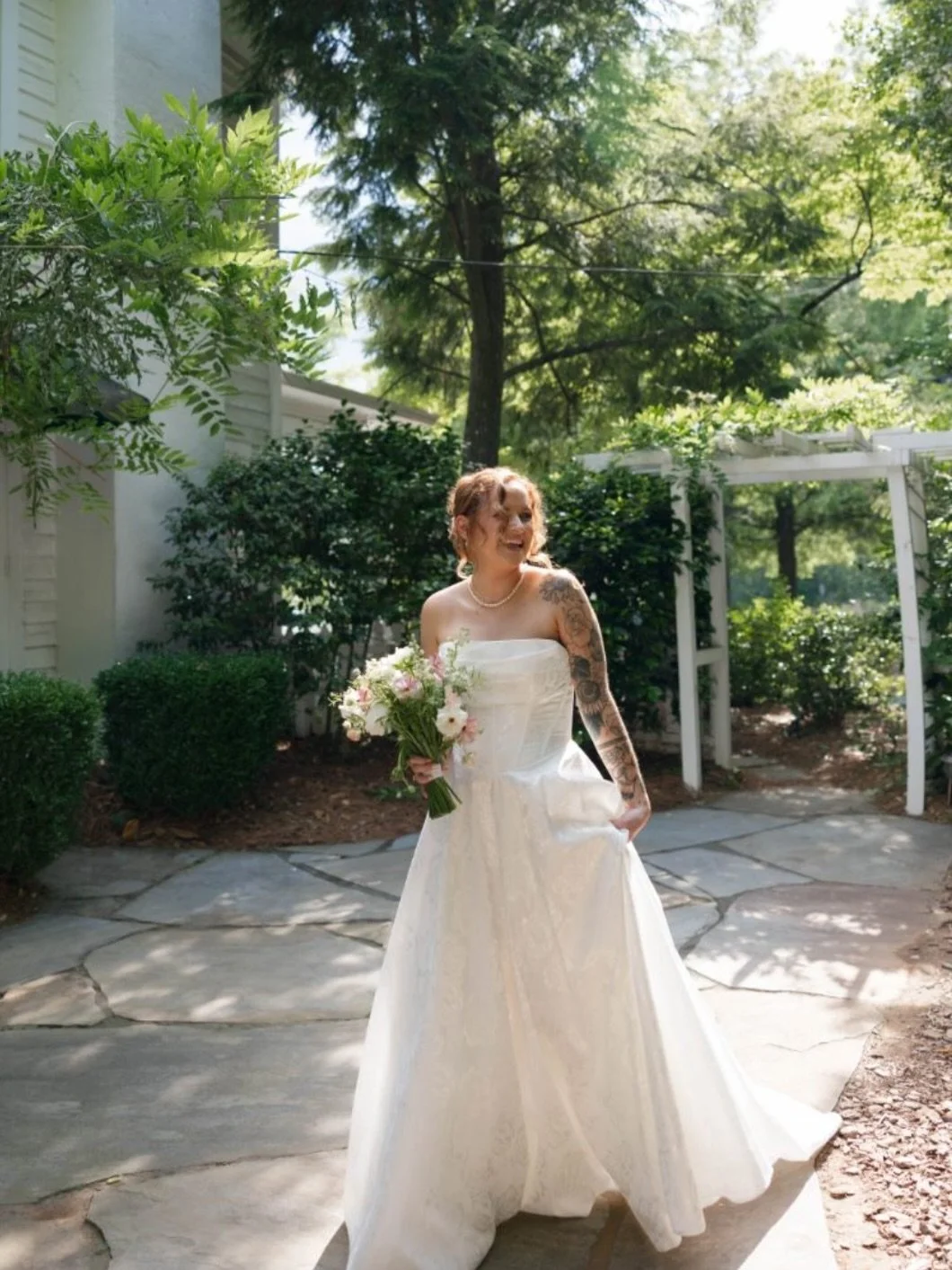 Melissa looking radiant in our Greer gown for her spring wedding. 🤍
