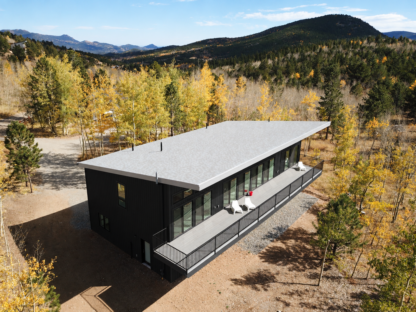 Black Modern Cabin in Autumn Mountains.png