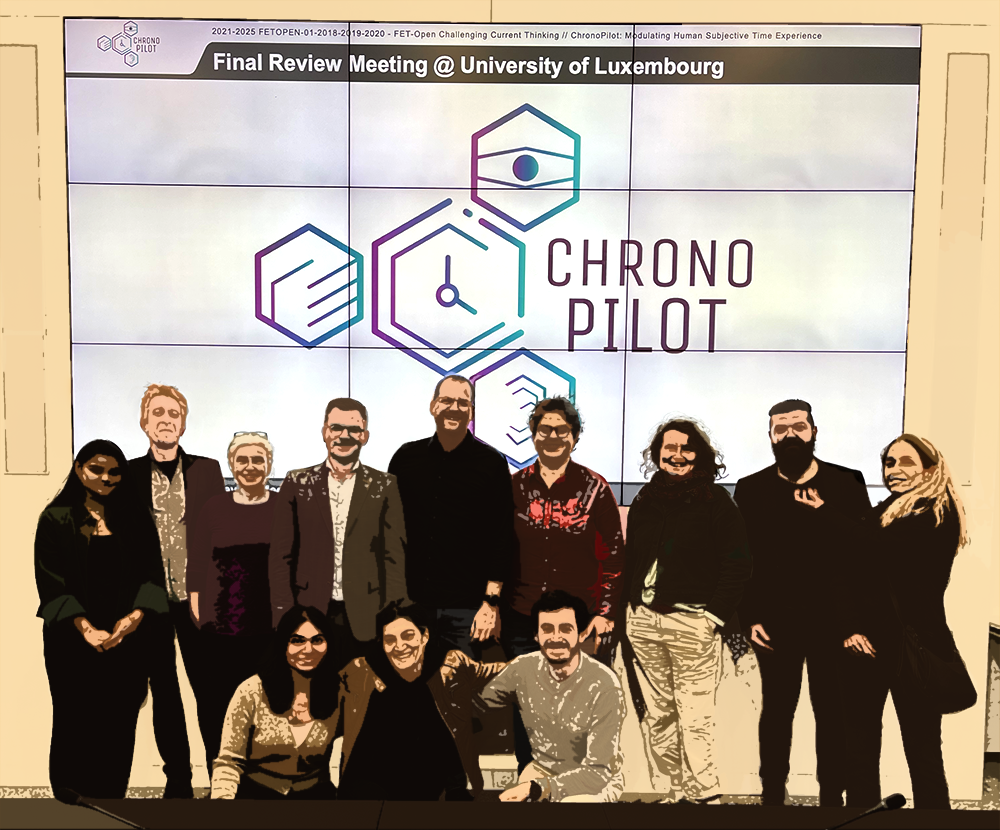 Group photo of the ChronoPilot research team at the University of Luxembourg during the Final Review Meeting, standing in front of a large screen displaying the ChronoPilot logo.