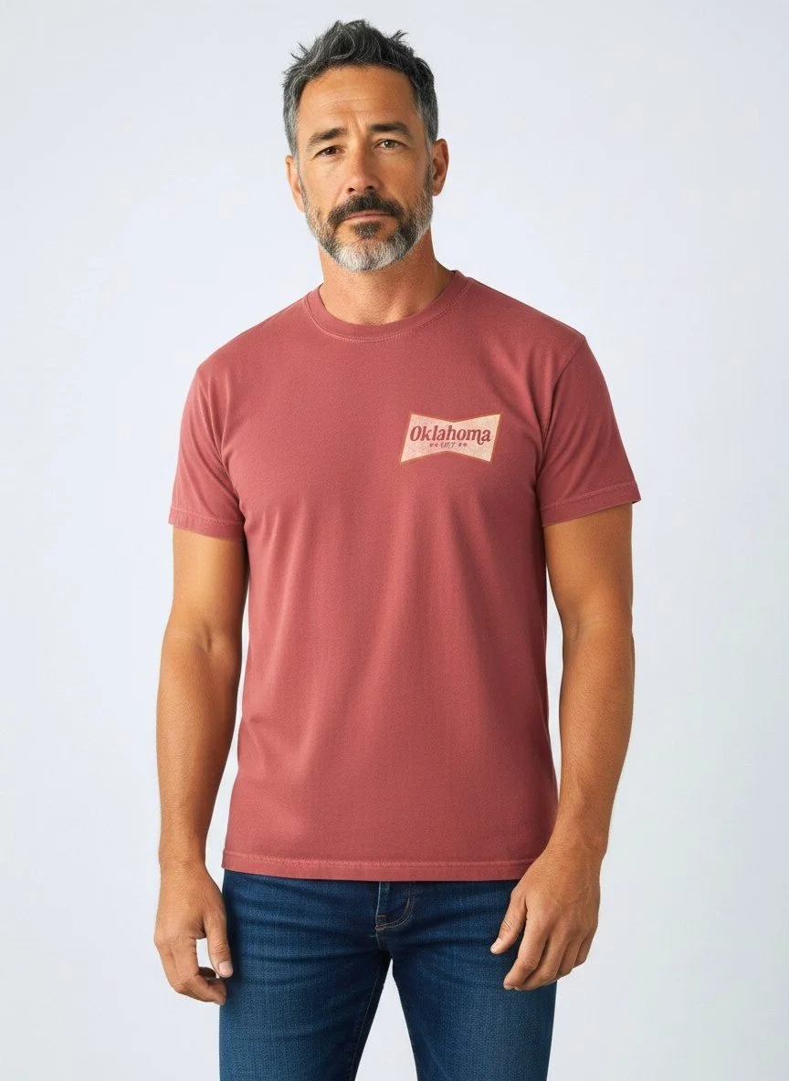 Model wearing Shop Good's maroon Oklahoma Beer tee with a vintage Oklahoma label graphic