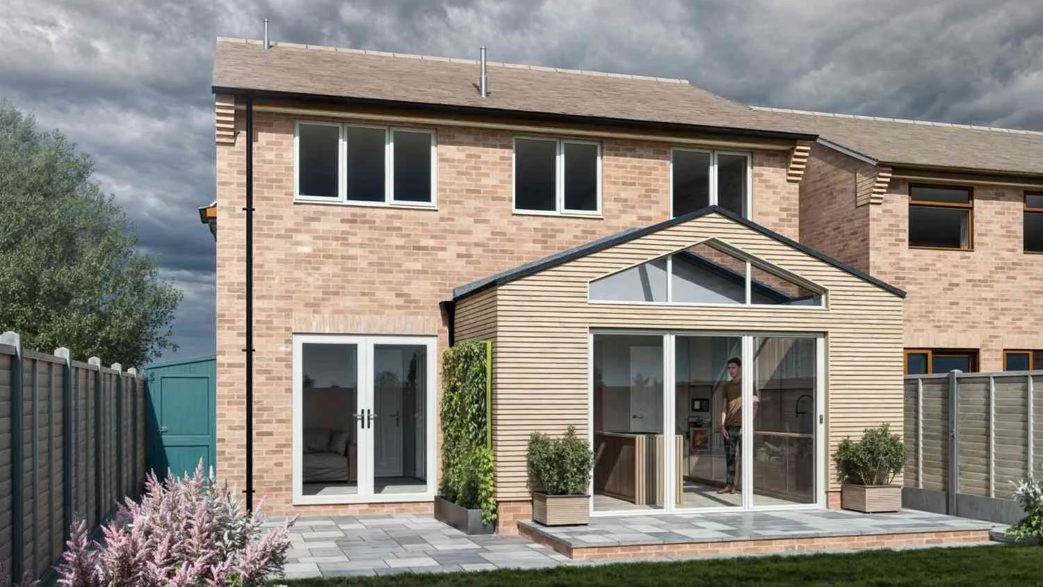 Single-storey rear extension in Walsall with pentagon gable glazing, bifold doors, and Millboard Shadow Line+ cladding. McTernan Design provided detailed planning drawings for this modern open-plan kitchen-dining space.