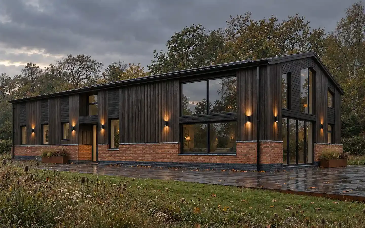 Proposed 3D view of a barn conversion in Bromsgrove, showing a family home in the open countryside with dark millboard cladding, reclaimed brickwork and large glazed openings.