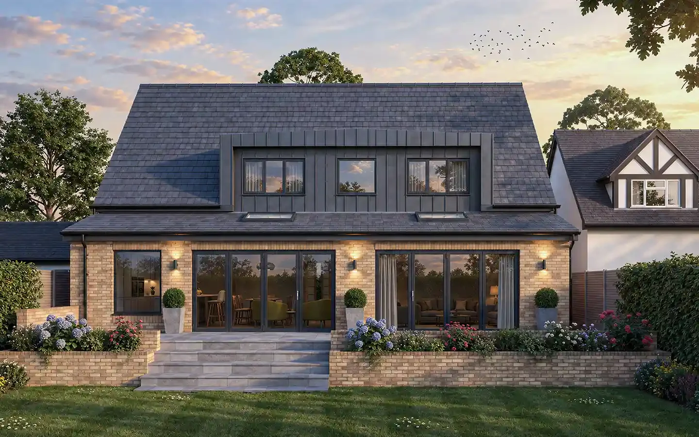 Proposed rear garden view of a bungalow in Solihull with a single-storey rear extension, loft conversion and raised patio.