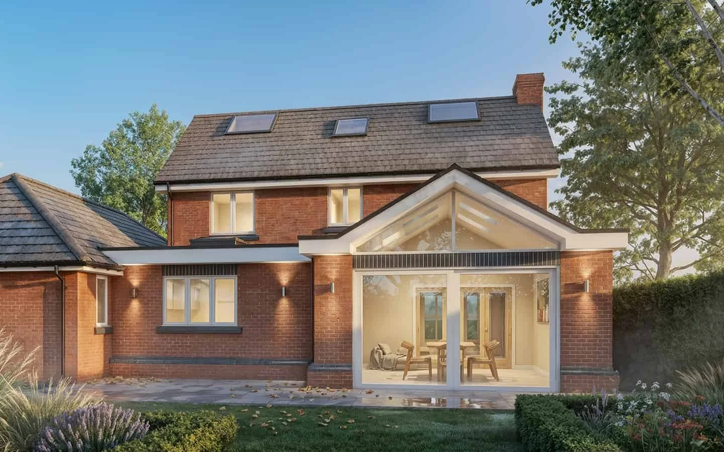 Single-storey extension in Solihull combining a vaulted ceiling over the living space with a flat roof over the new kitchen.