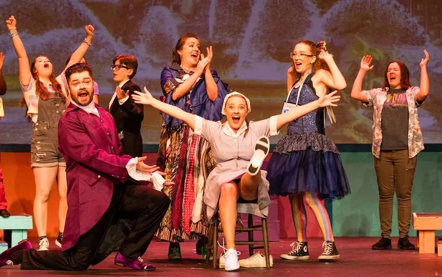 An ensemble finale in a Cinderella pantomime script production