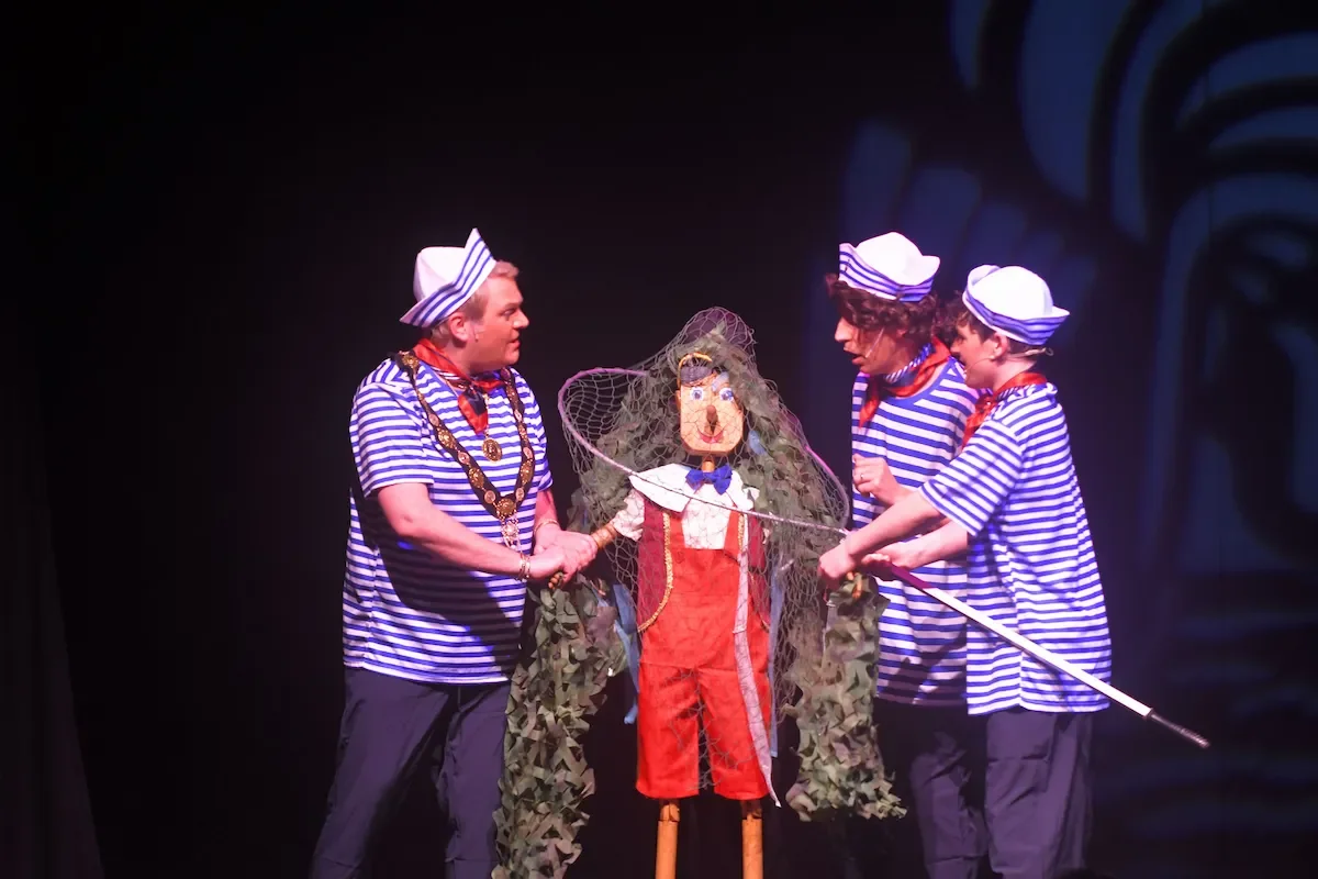Dame Geppetto and the gang accidentally catching Pinocchio in a fishing net