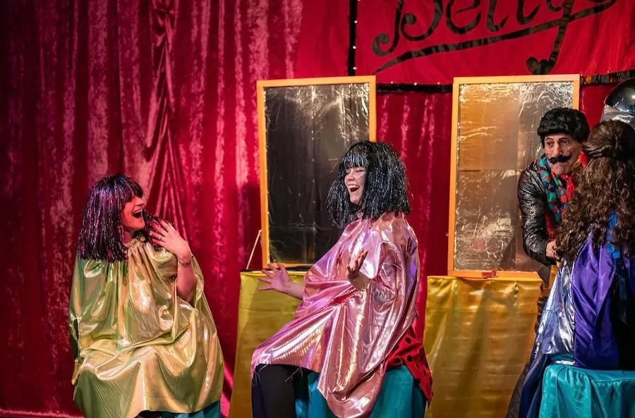 A scene at Betty Beehive's salon in Rapunzel pantomime script performance