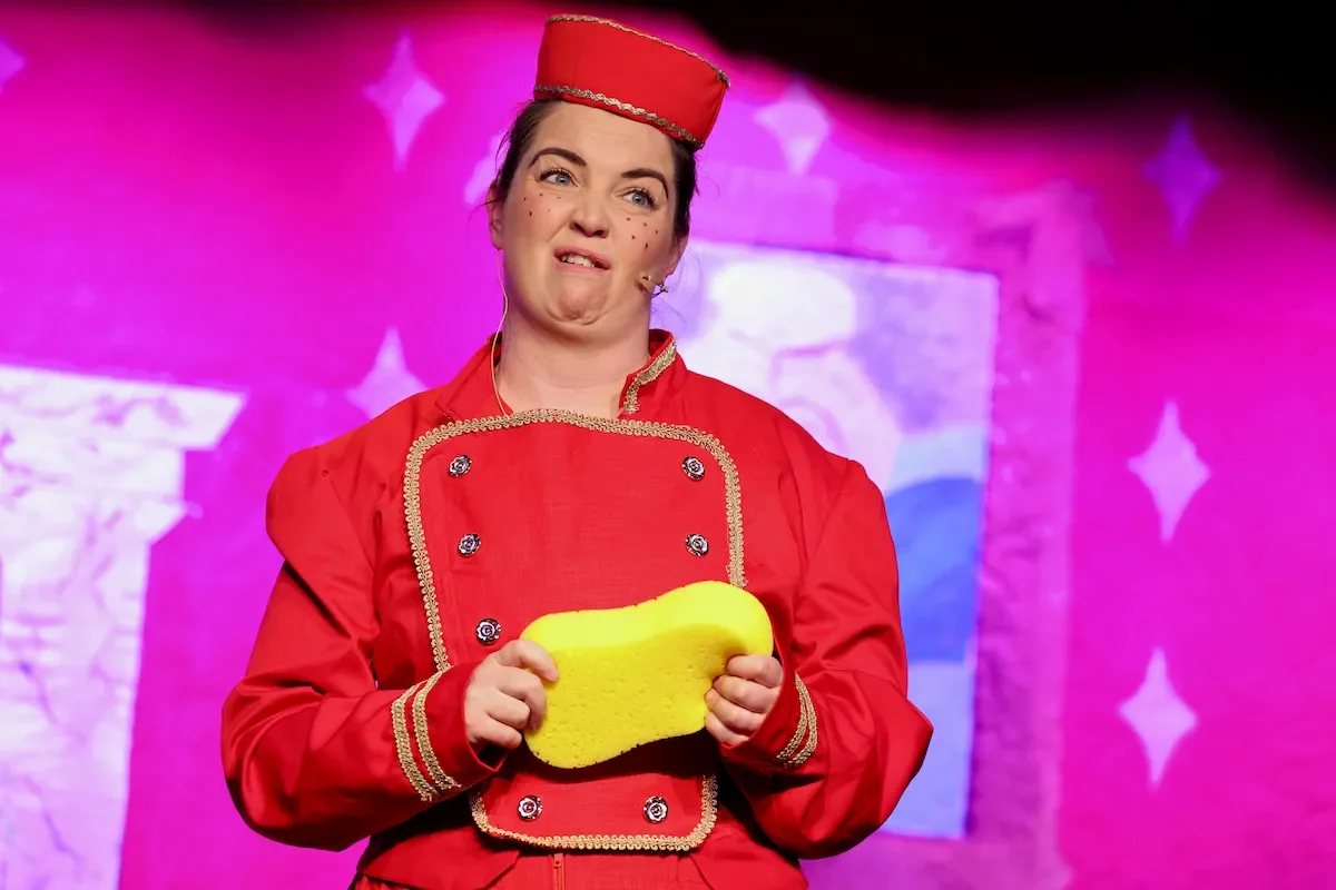 A performer in a production of Cinderella Pantomime Script