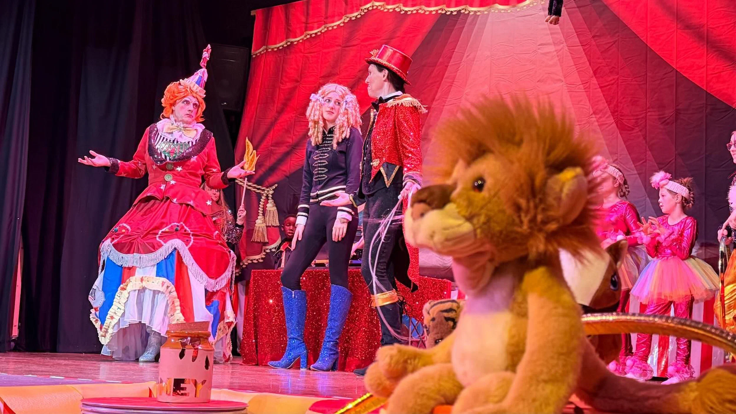 Goldilocks and the Three Bears pantomime script performance photo featuring Dame Barnum, Ringo and Goldilocks in the Big Top tent