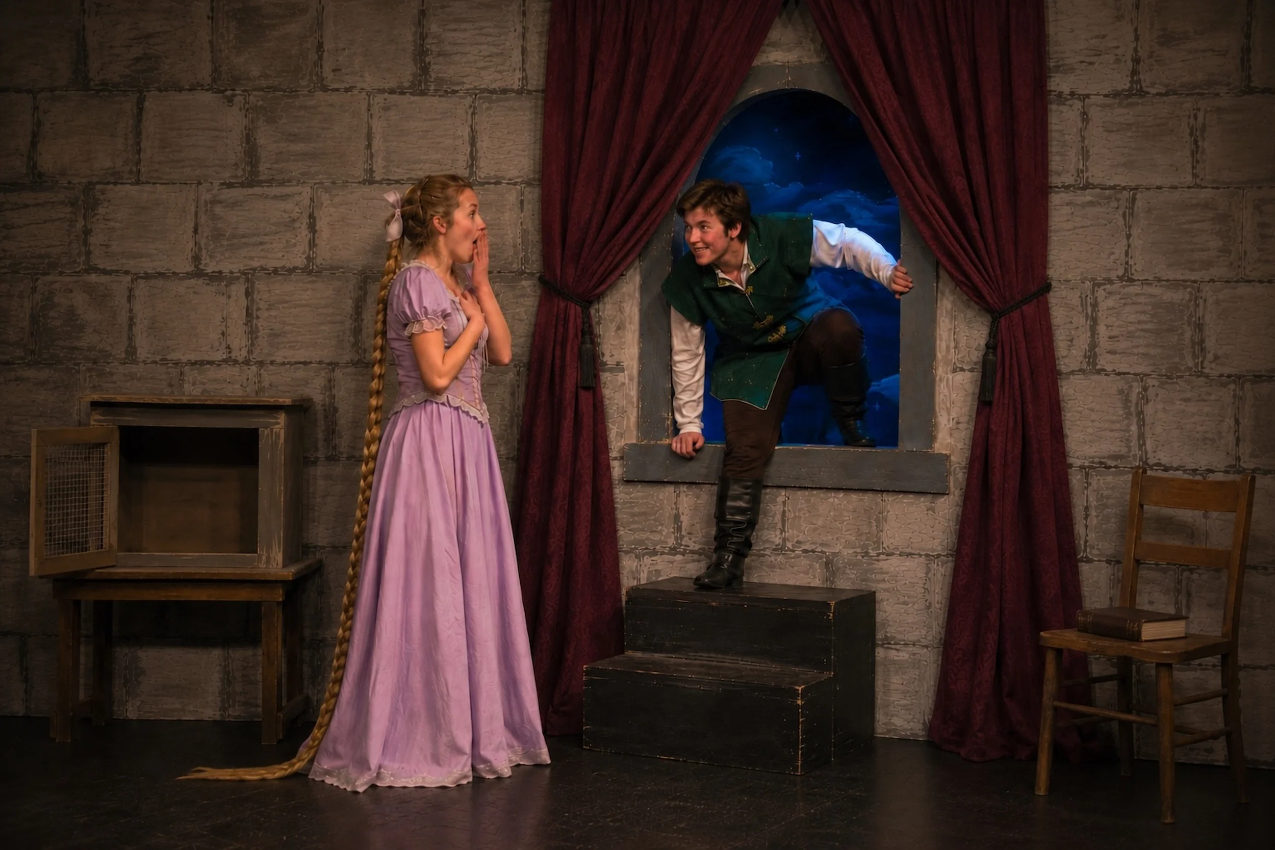 Actors in the tower in a Rapunzel pantomime script performance photo