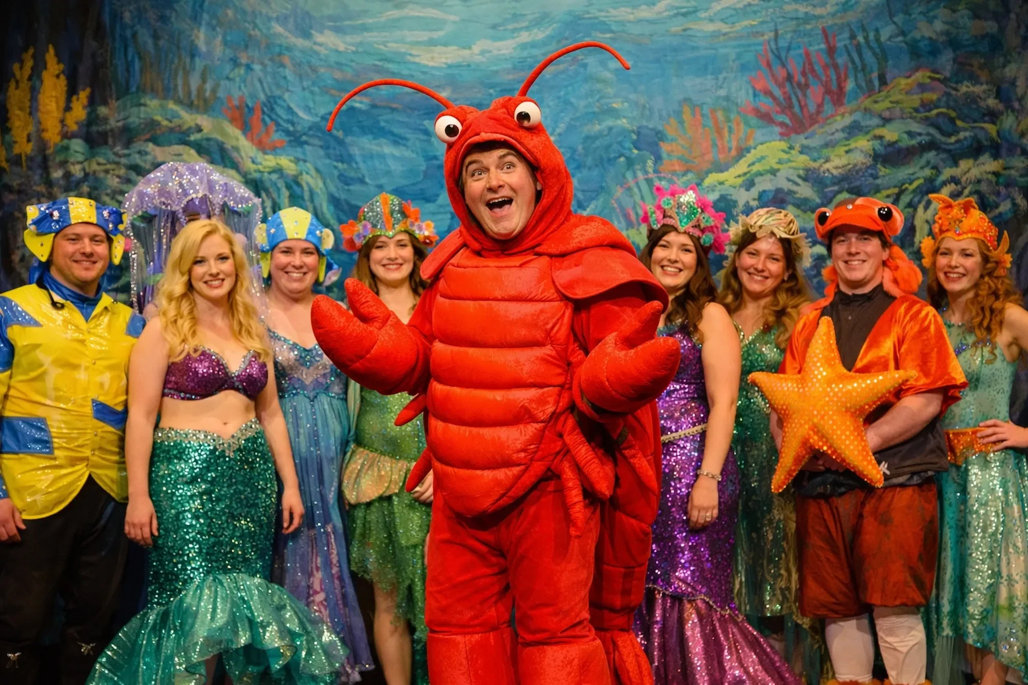 Performers in a production of the Little Mermaid pantomime script