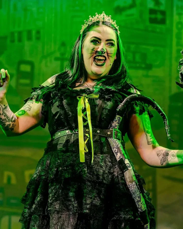 A performer as Queen Rat in a production of Dick Whittington