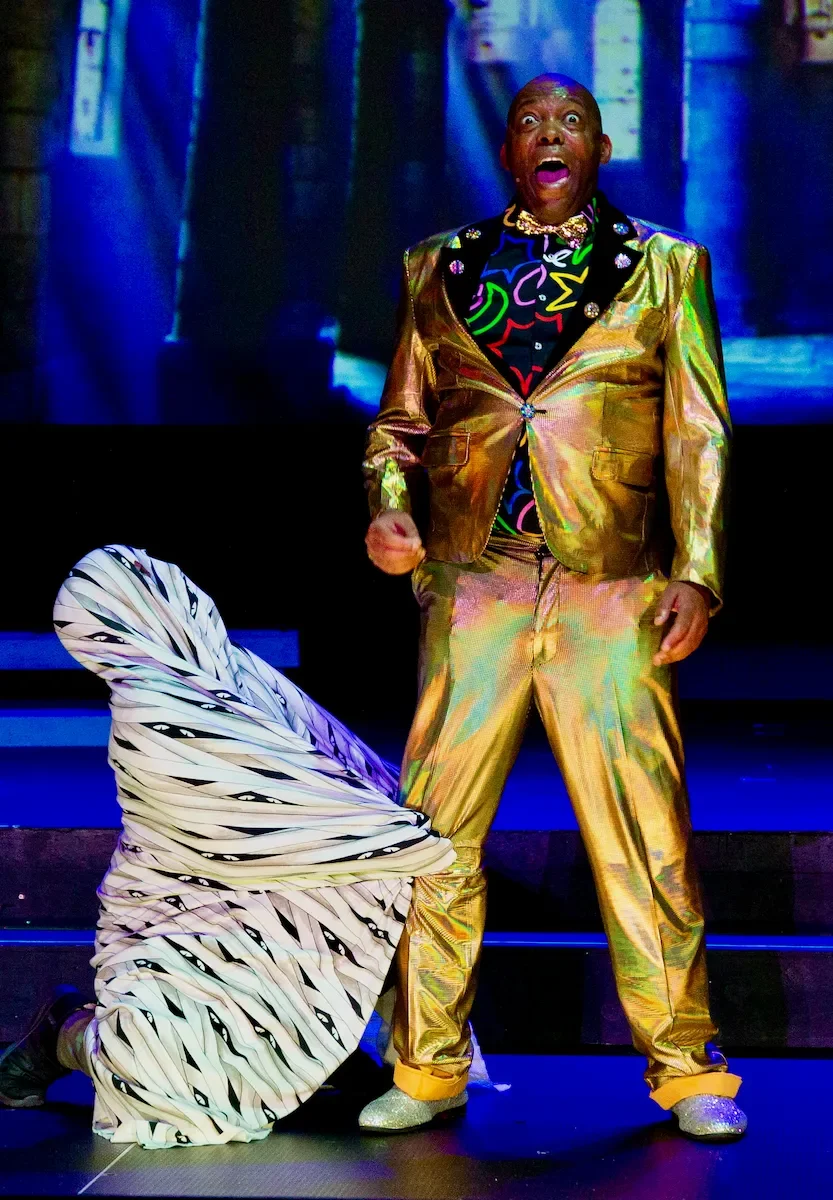 Performers as Buttons and a ghost in a production of Cinderella pantomime script