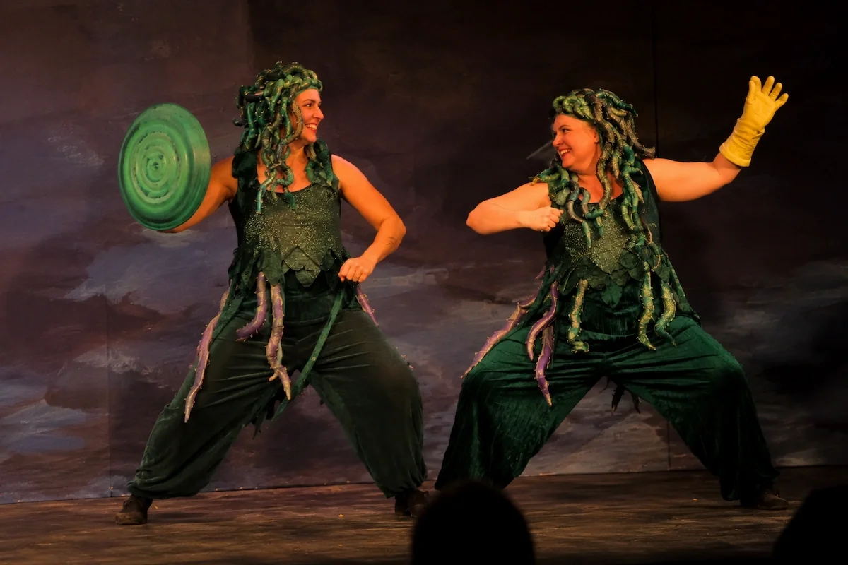 Two performers as Slip and Slap, the henchmen showing off their 'weapons'