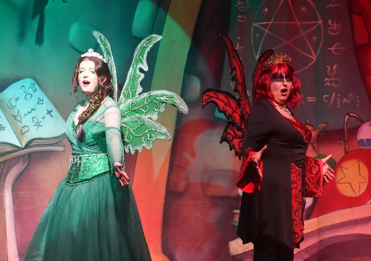 A Good Fairy in green with extravagant fairy wings and a Bad Fairy in red with wicked wings