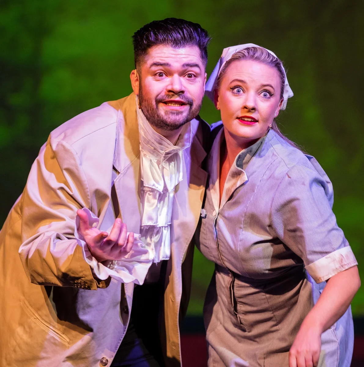 Cinderella and the Prince meeting in the forest in a pantomime production
