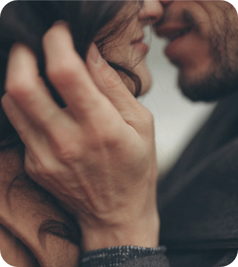 Therapy in Kitchener, Close-up of a couple about to kiss, with focus on their faces and hands.