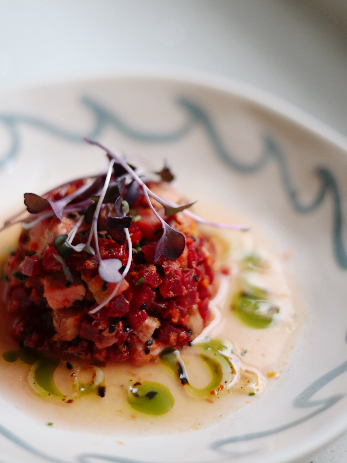 simple. clean. good. 

blue fin ahi tuna - red beetroot - calabrian chili peppers - mint oil - chives - sesame seeds - citrus maple sauce - toasted shallots - purple radish micros