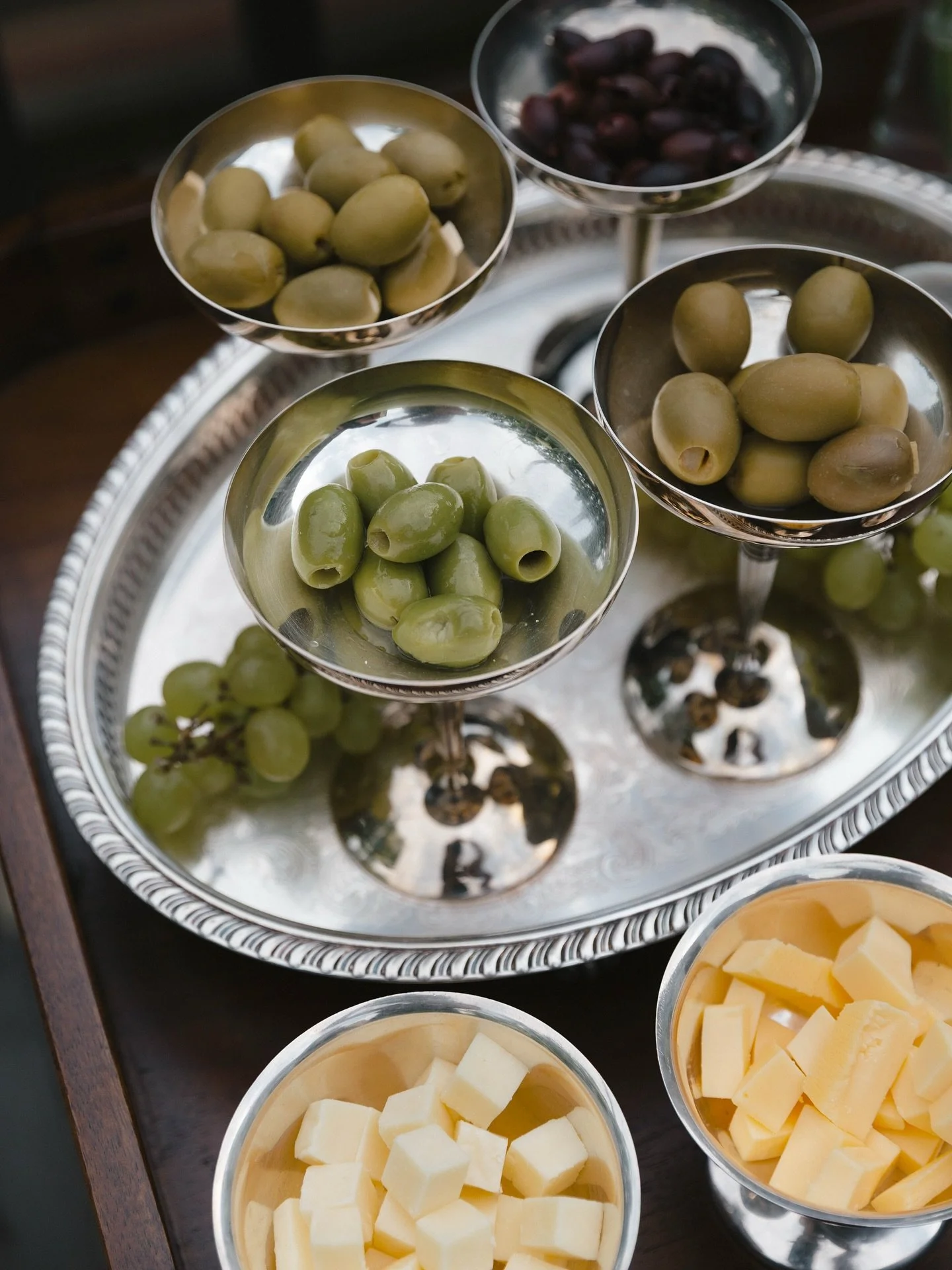 The olive is our symbol &mdash; a timeless sign of peace, friendship, and welcome. Whether shared in a bowl or poured over warm bread, it invites conversation and connection, reminding us that the table is where we truly come together.