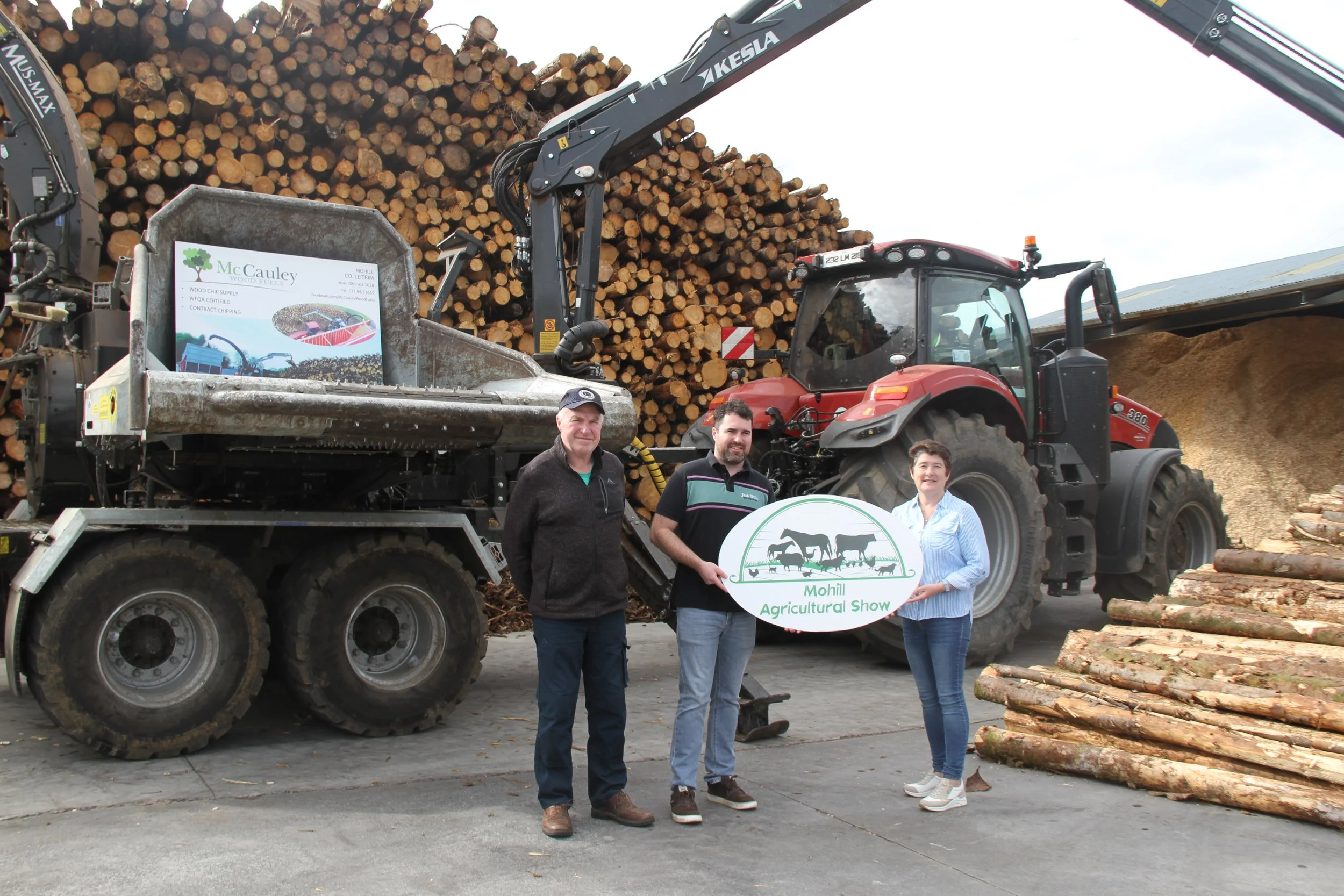 Brian & Kenny Mc Cauley of Mc Cauley Wood Fuels along with Kathleen Ellis, Secretary of Mohill Show