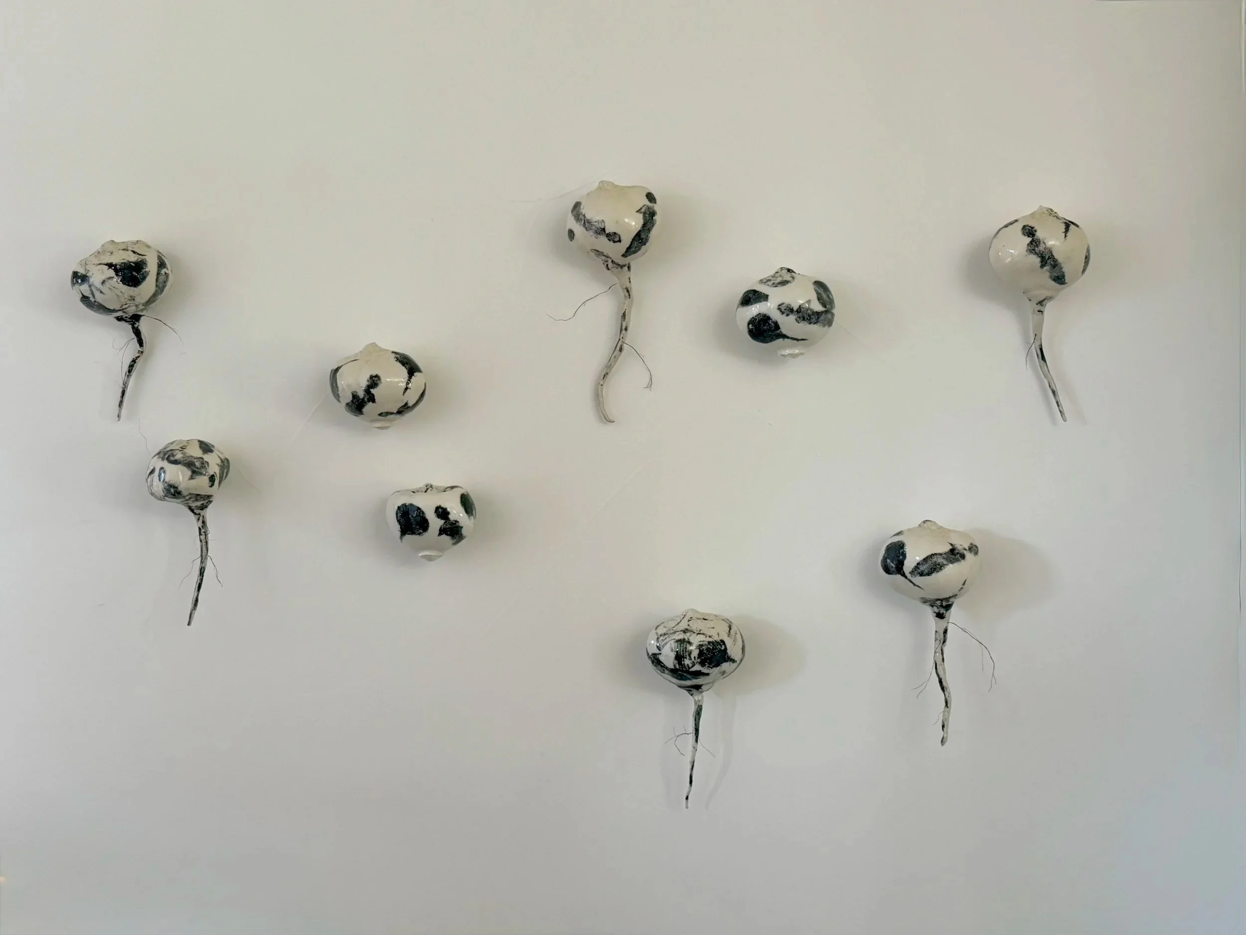 Bind/Beet, 2026, Ceramic and jute, 32 x 50 x 5 inches 