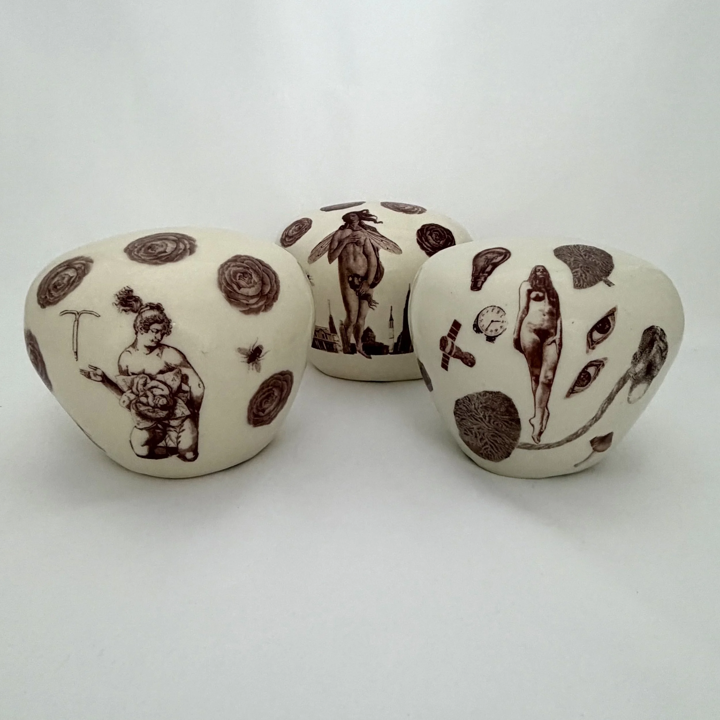 Milagros Uteruses, Porcelain with waterslide decals, 2026, 6x6x6 inches 