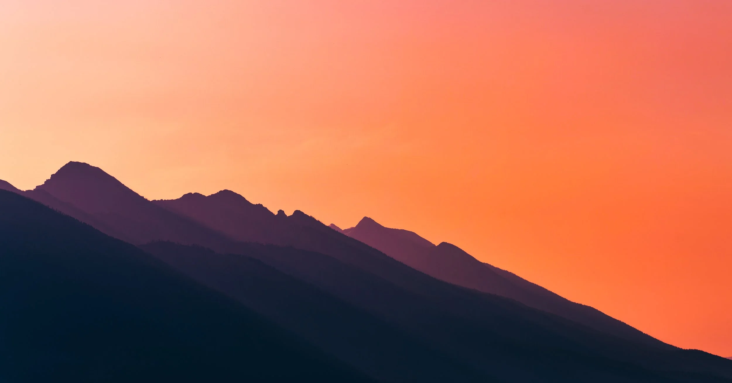 Sunset Layers: Wyoming Mountain Silhouettes