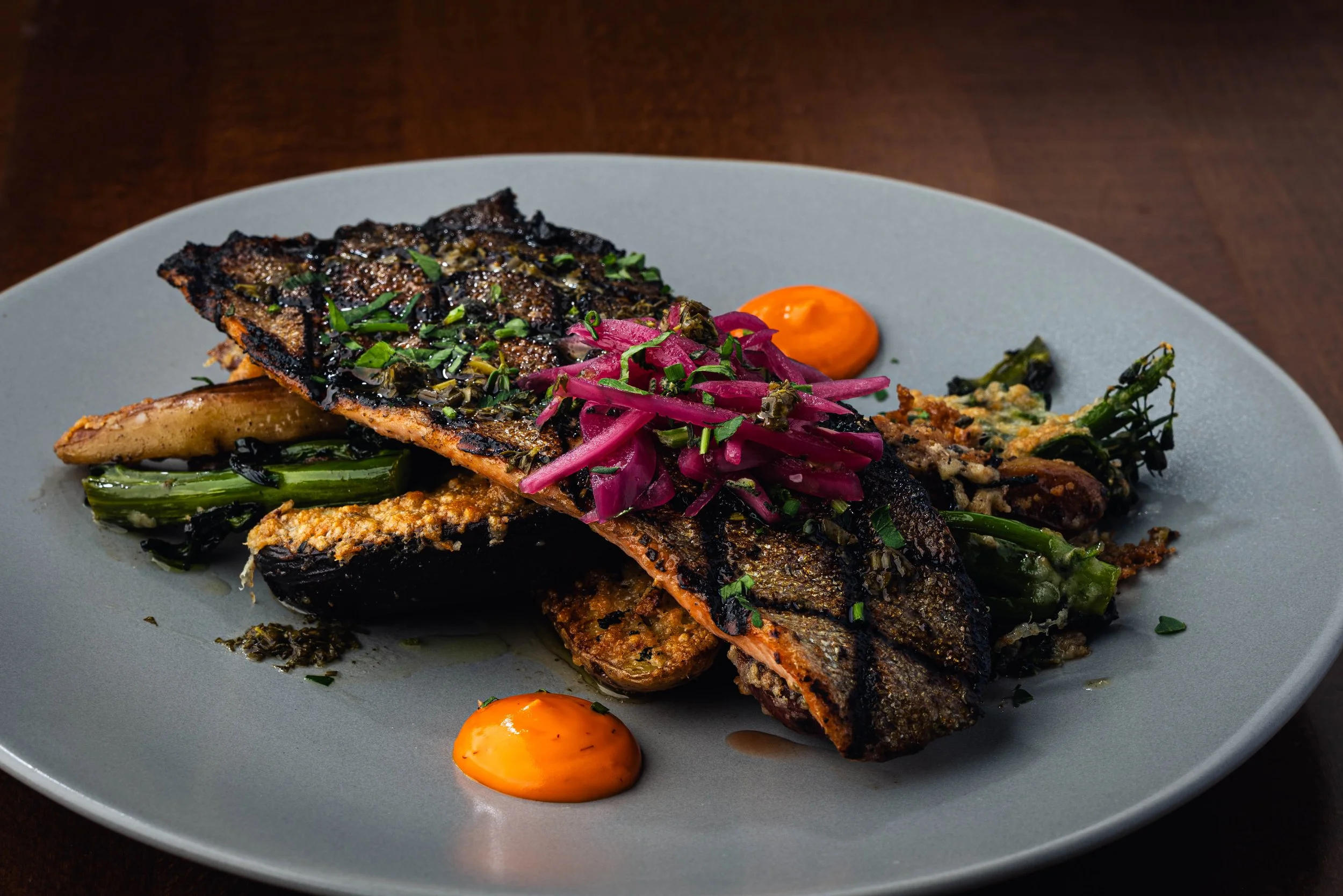 Trout Tuscan Style 
Herb marinated, parmesan roasted fingerling potatoes, broccolini, saffron-caper aioli