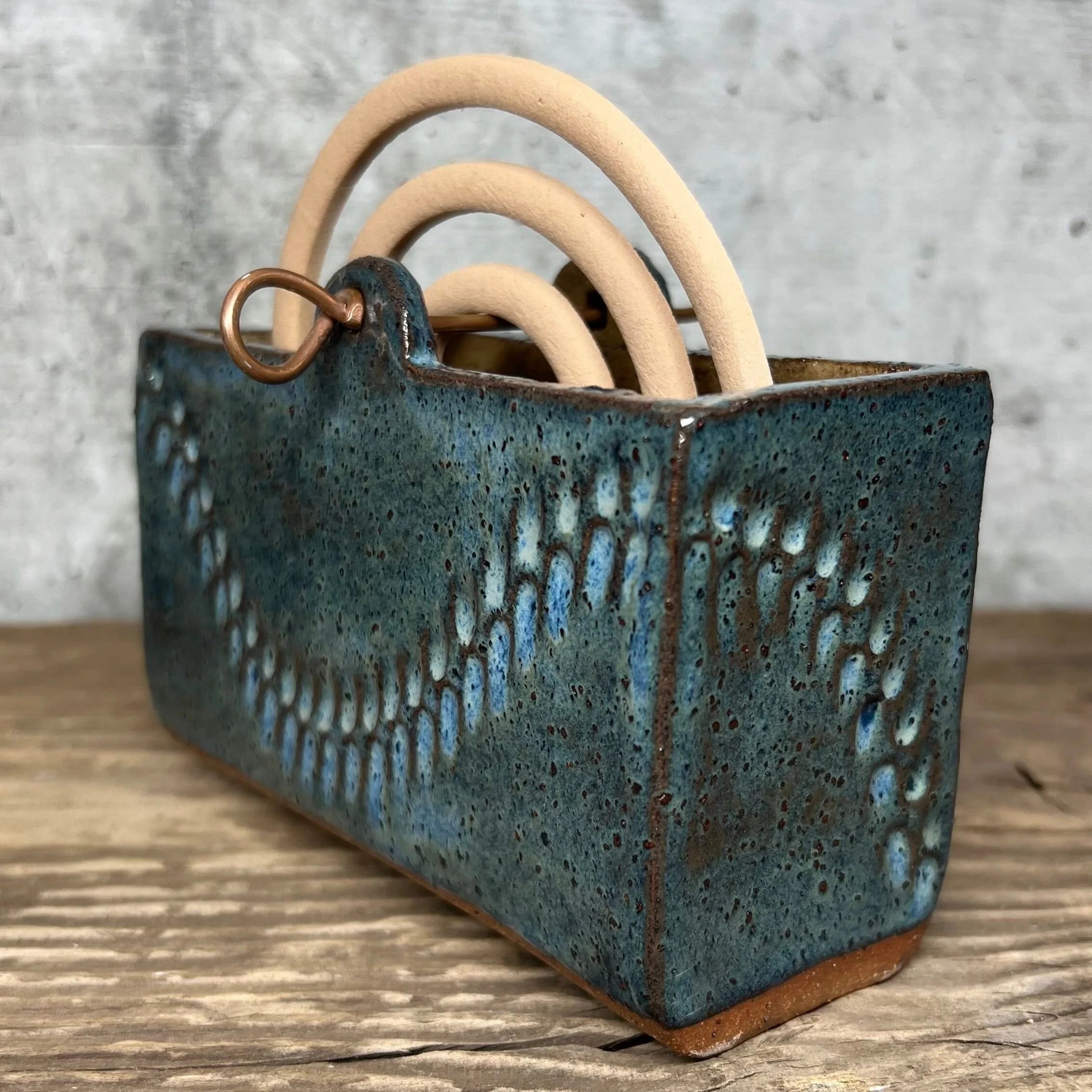handcrafted mozzie coil holder, made from durable stoneware clay and finished in  blue.