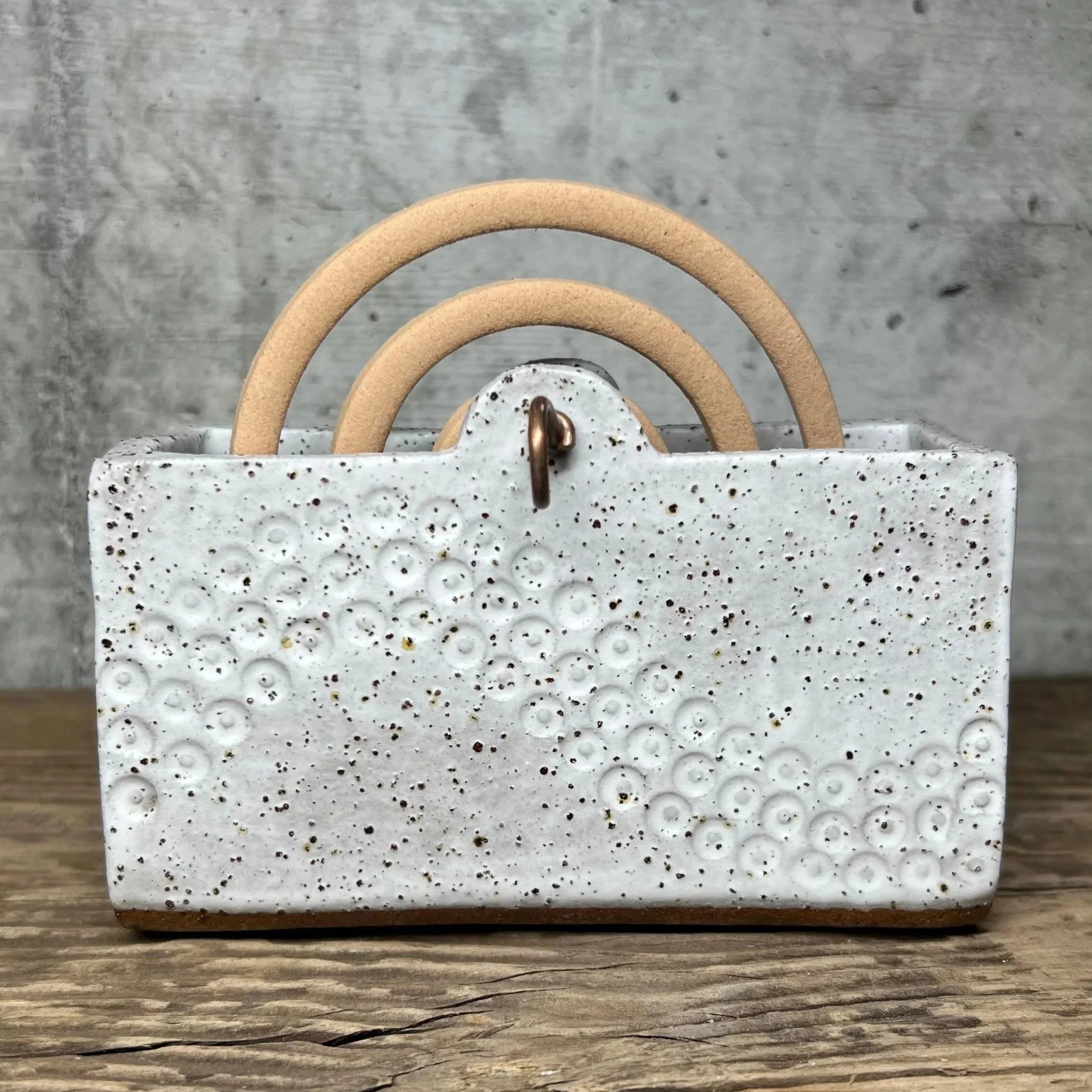 handcrafted mozzie coil holder, made from durable stoneware clay and finished in white.