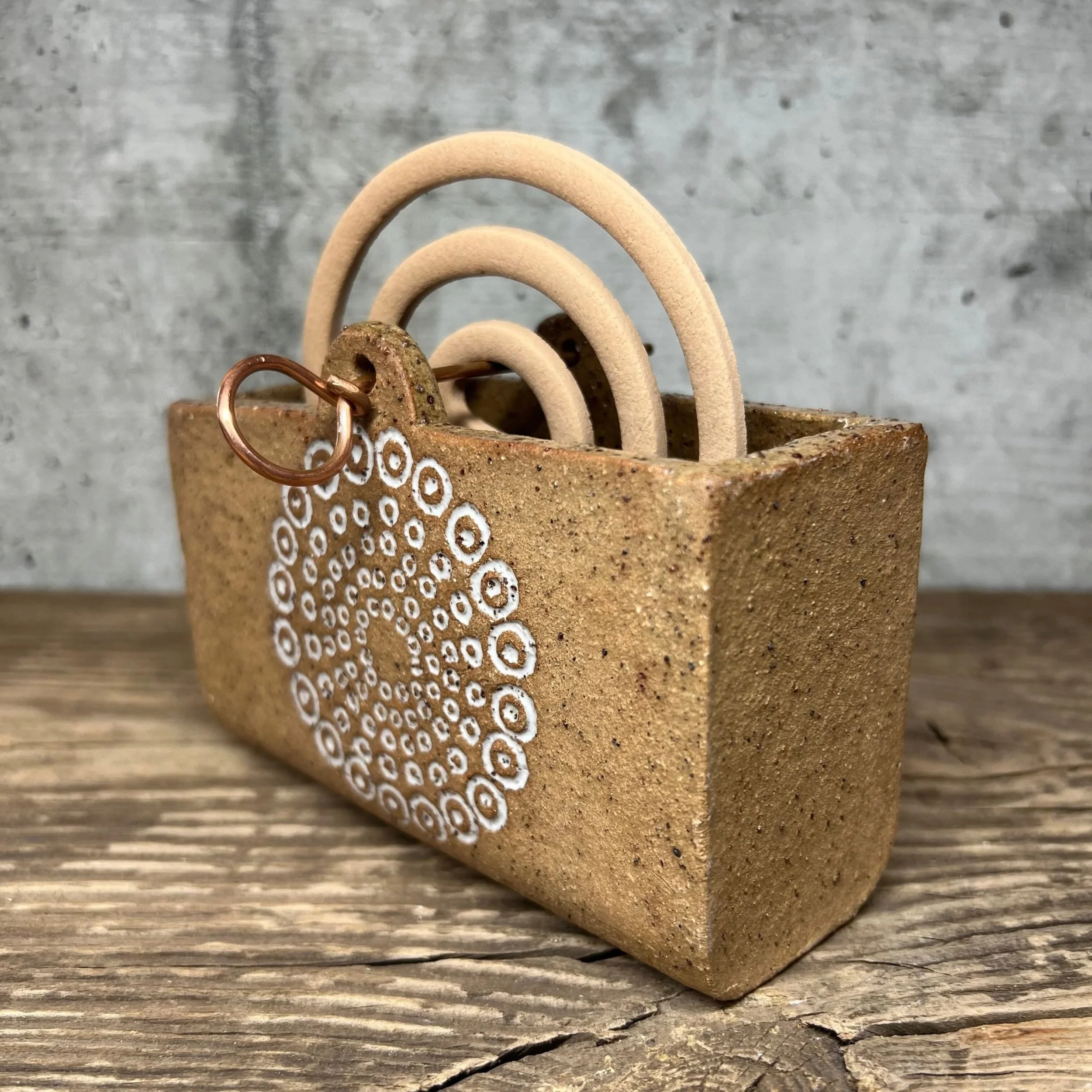 handcrafted mozzie coil holder, made from durable stoneware clay and finished with a white glaze inlay white.