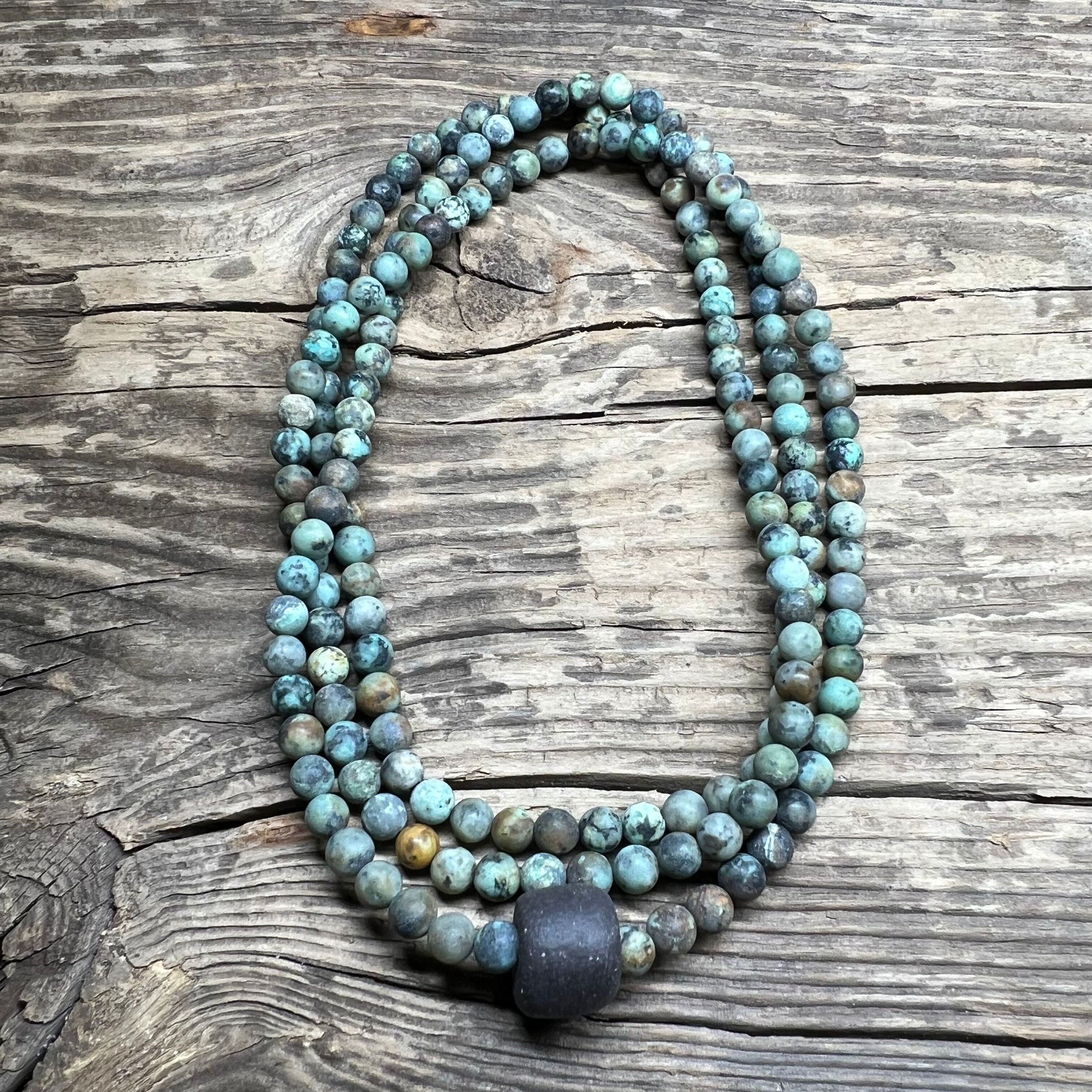 African Turquoise necklace with a black clay bead