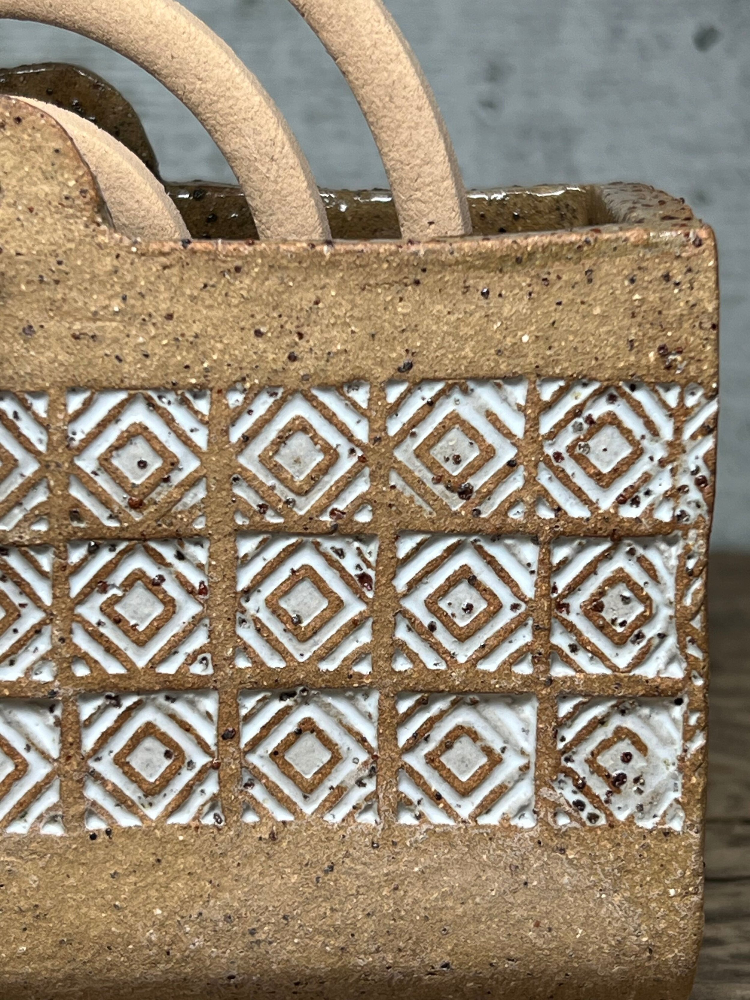 handcrafted mozzie coil holder, made from durable stoneware clay and finished with a white glaze inlay white