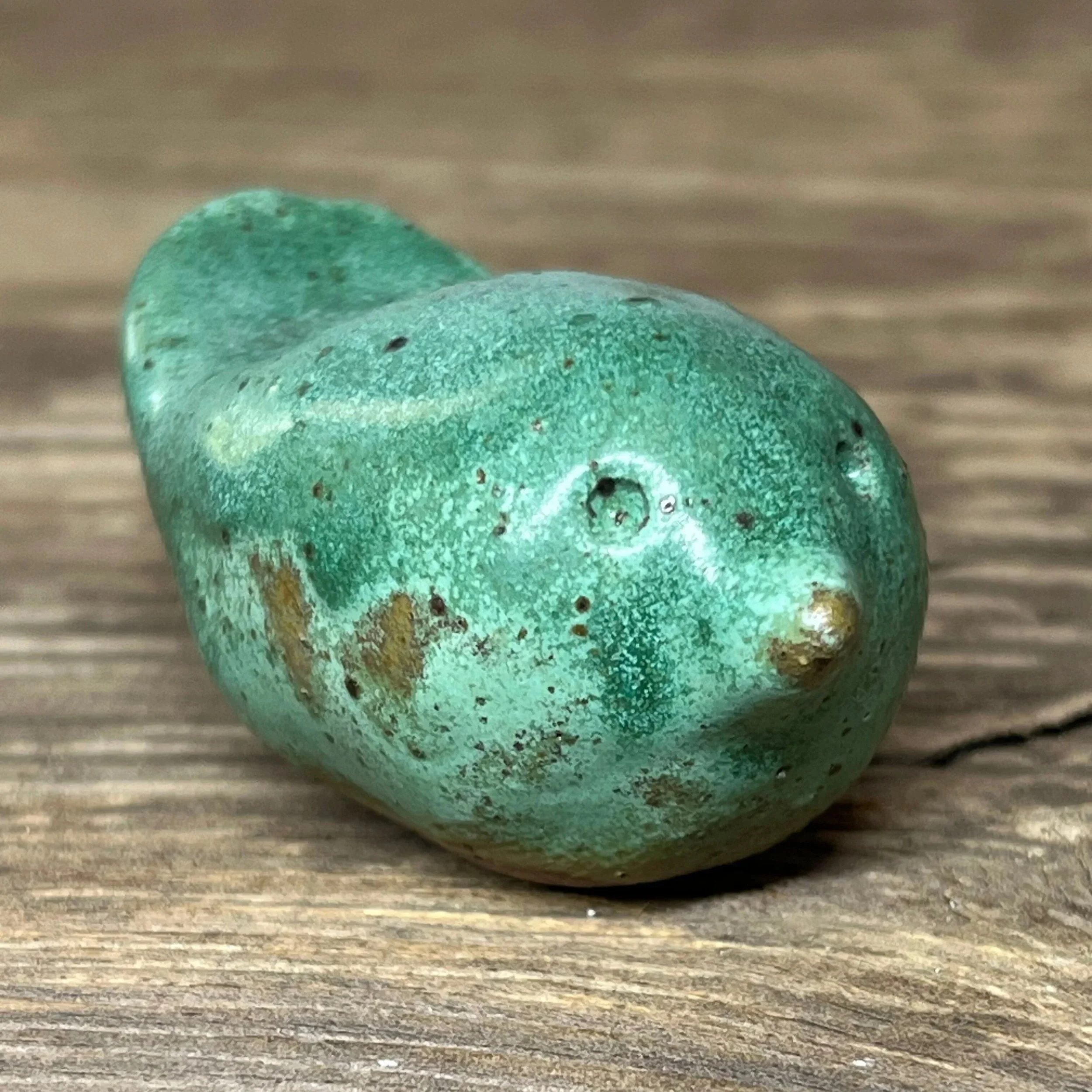 Ceramic bird handcrafted from stoneware clay and finished in a green glaze,