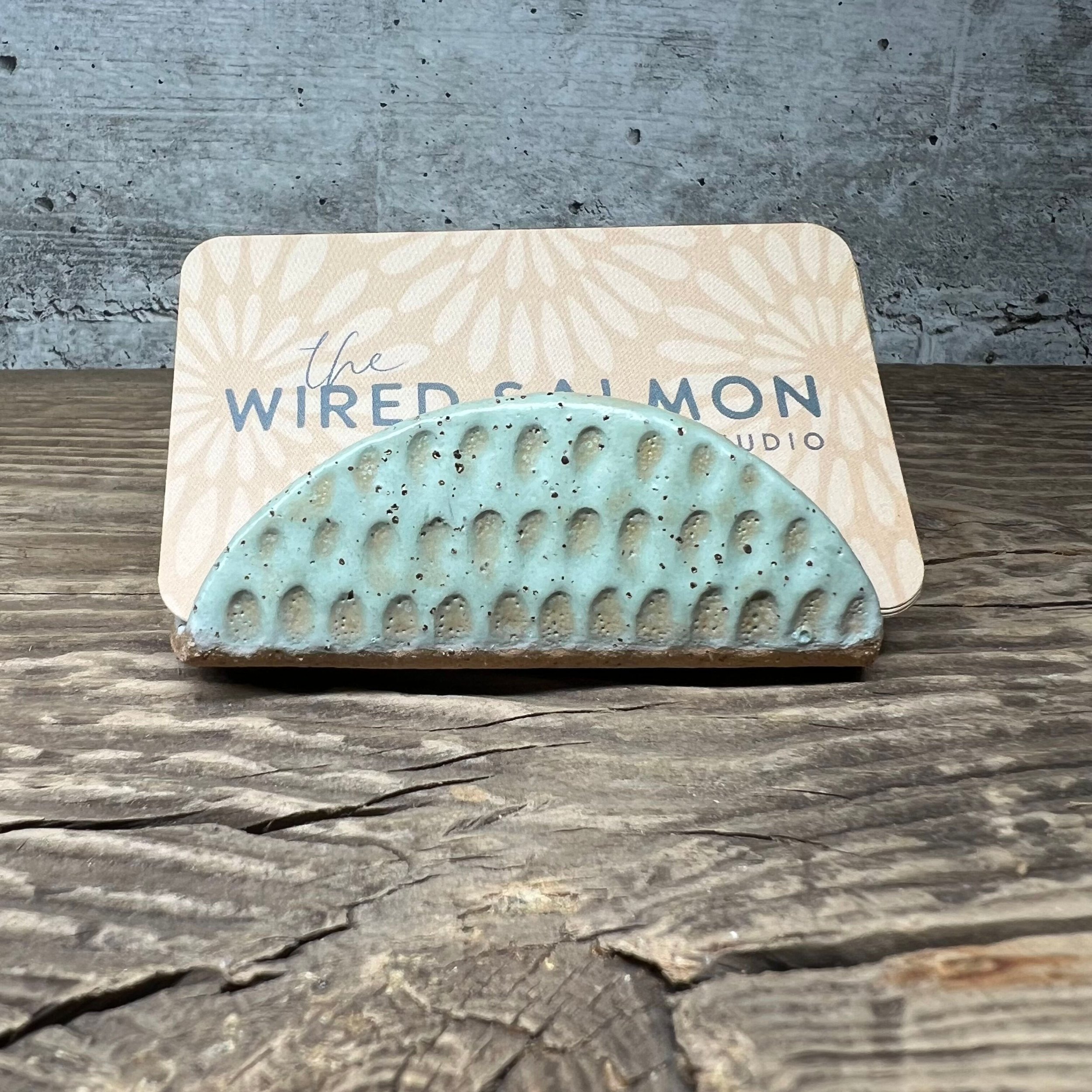 A handmade ceramic business card holder with a matte mint finish and subtle texture. (Copy) (Copy)