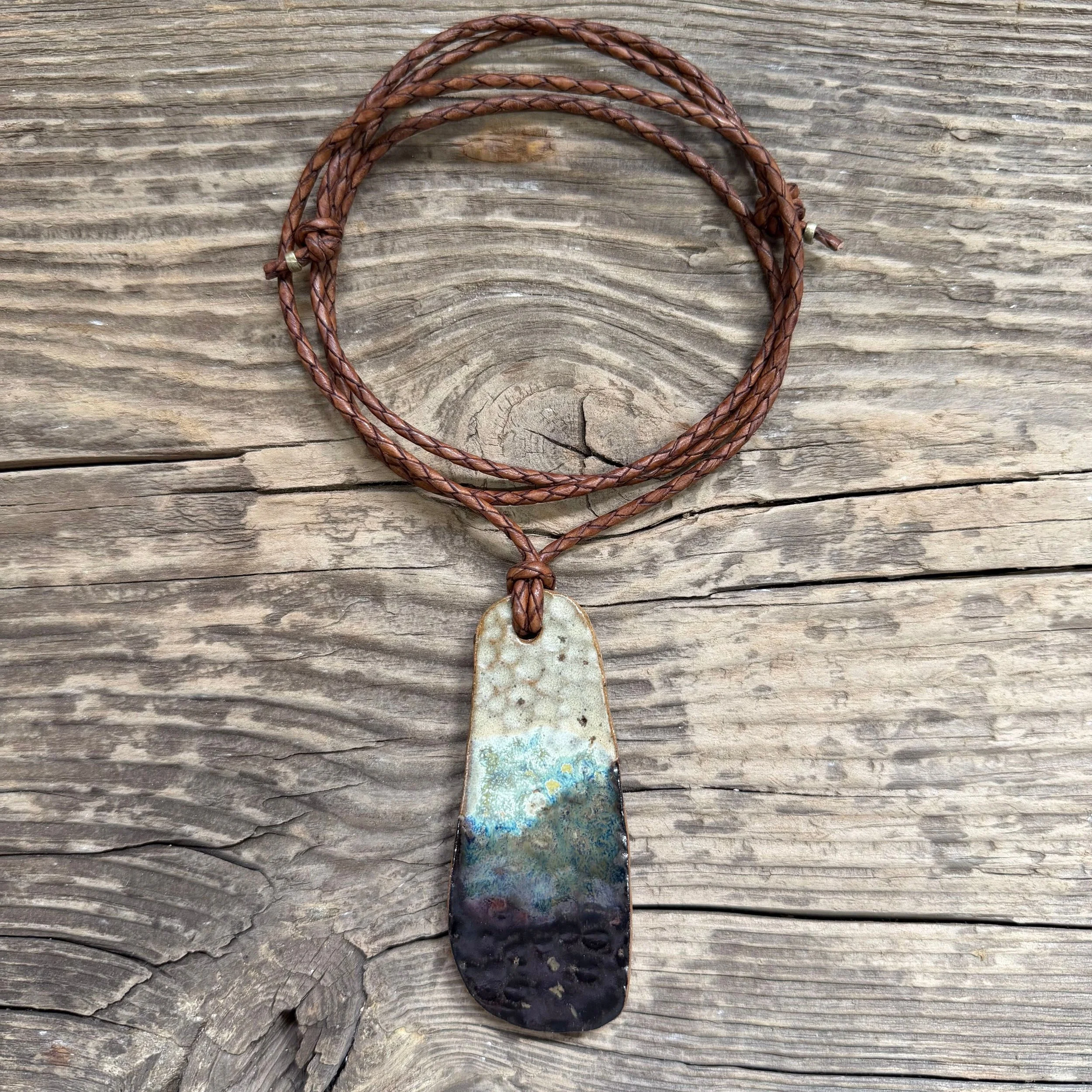 stoneware clay pendant with a delicious glaze combination of creams, walnut and blues.
