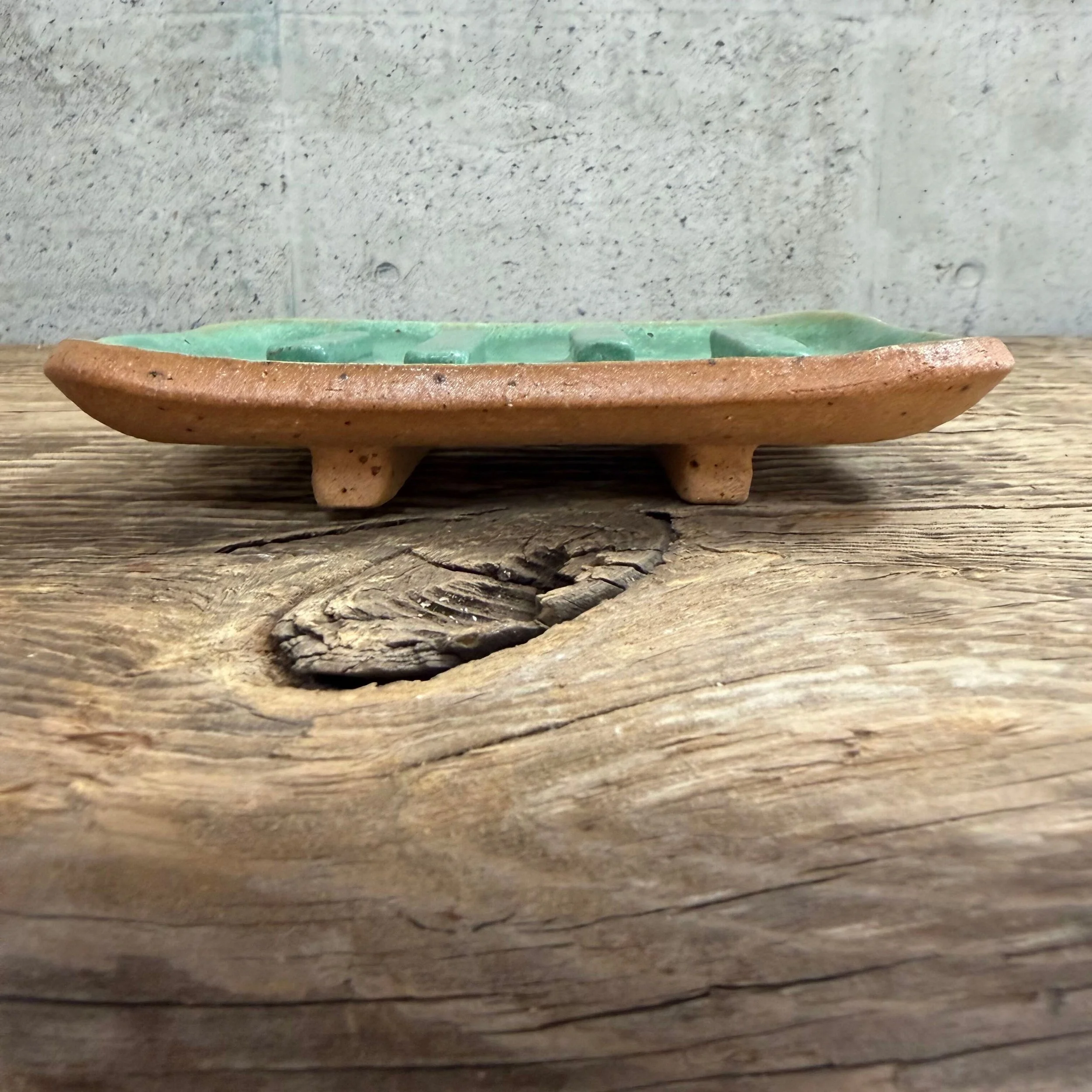 handcrafted soap dish, crafted from speckled stoneware clay and finished with a green glaze.