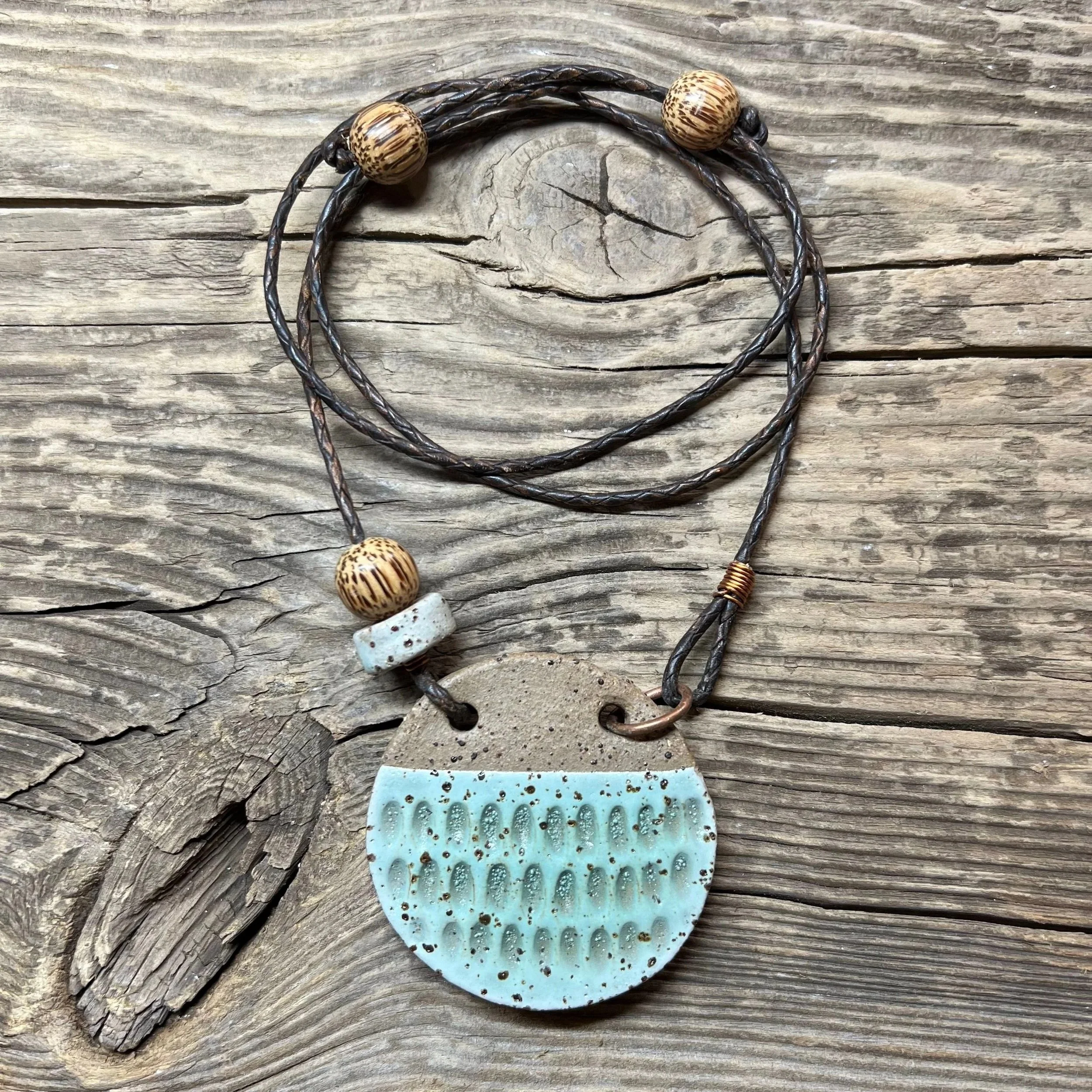 stoneware clay pendant and a ceramic and coconut wooden bead in mint.