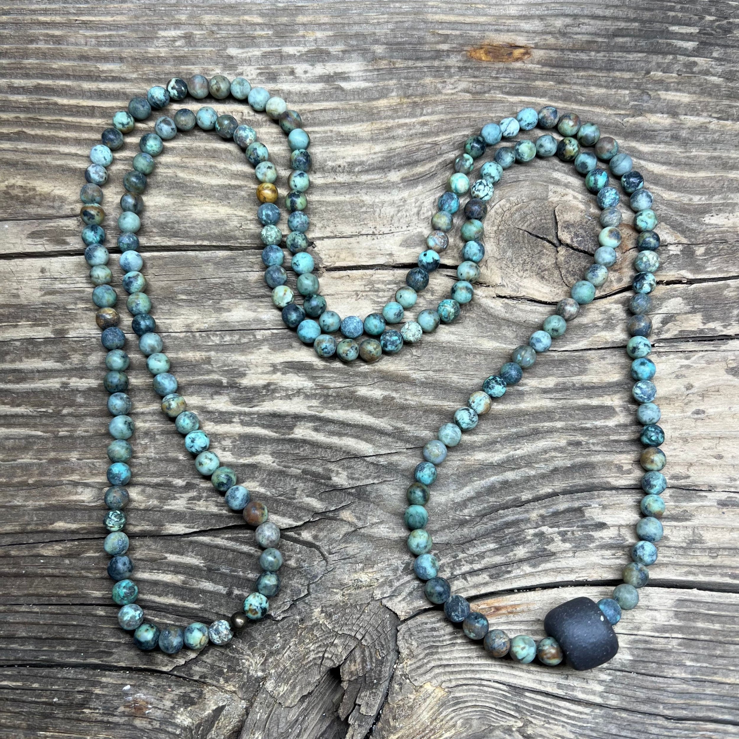 African Turquoise necklace with a black clay bead