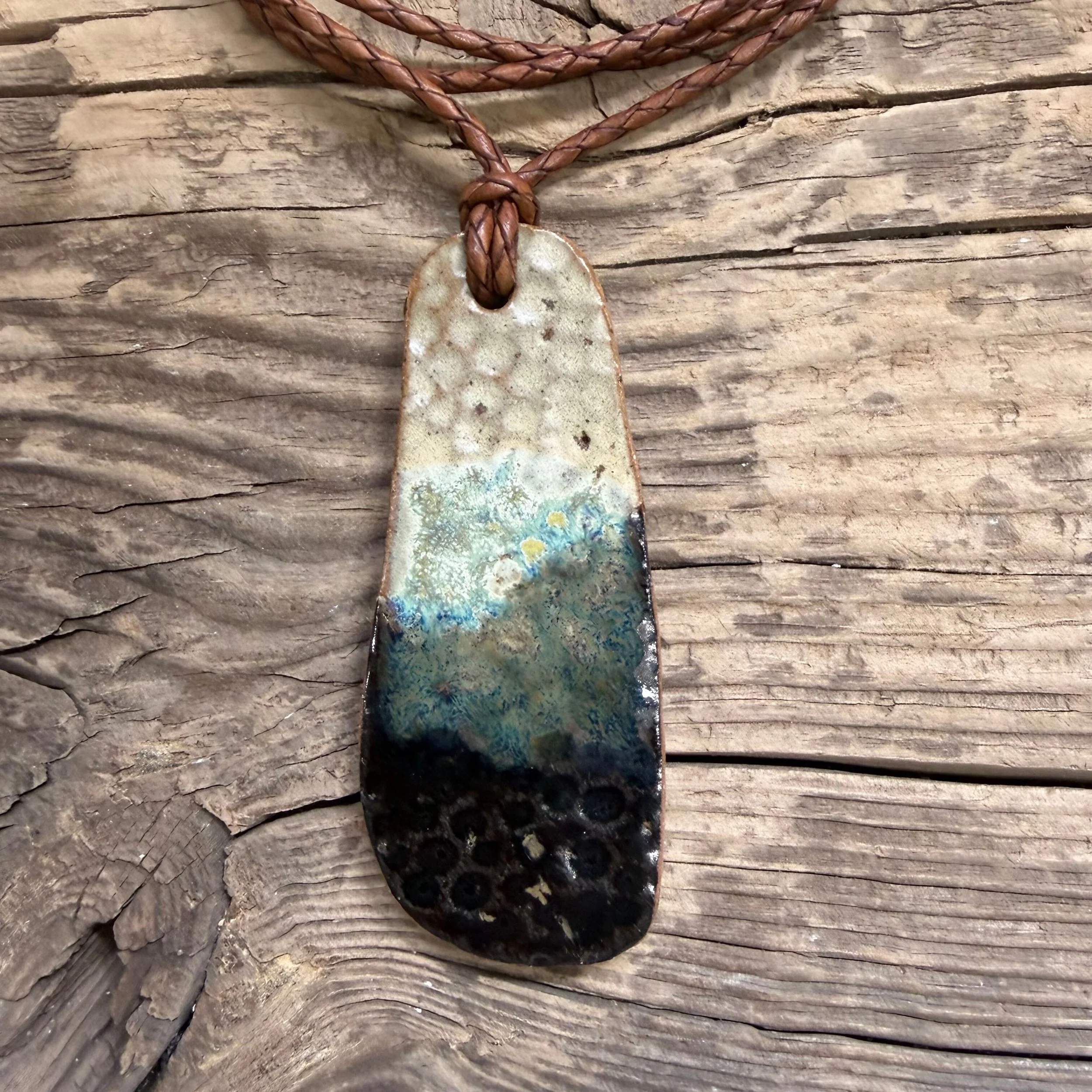 stoneware clay pendant with a delicious glaze combination of creams, walnut and blues.