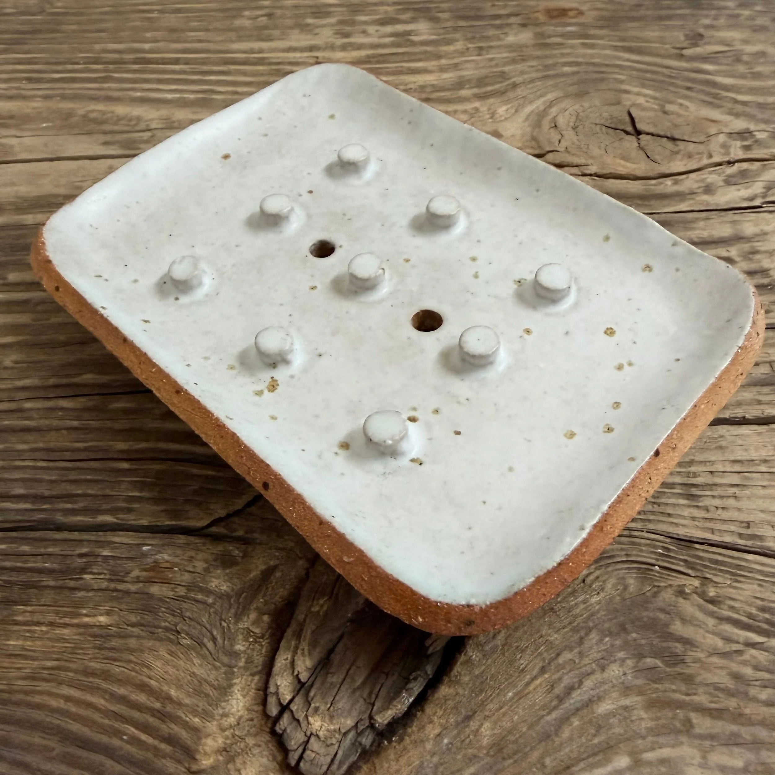 beautifully handcrafted soap dish, crafted from speckled stoneware clay and finished with a soft satin white glaze.
