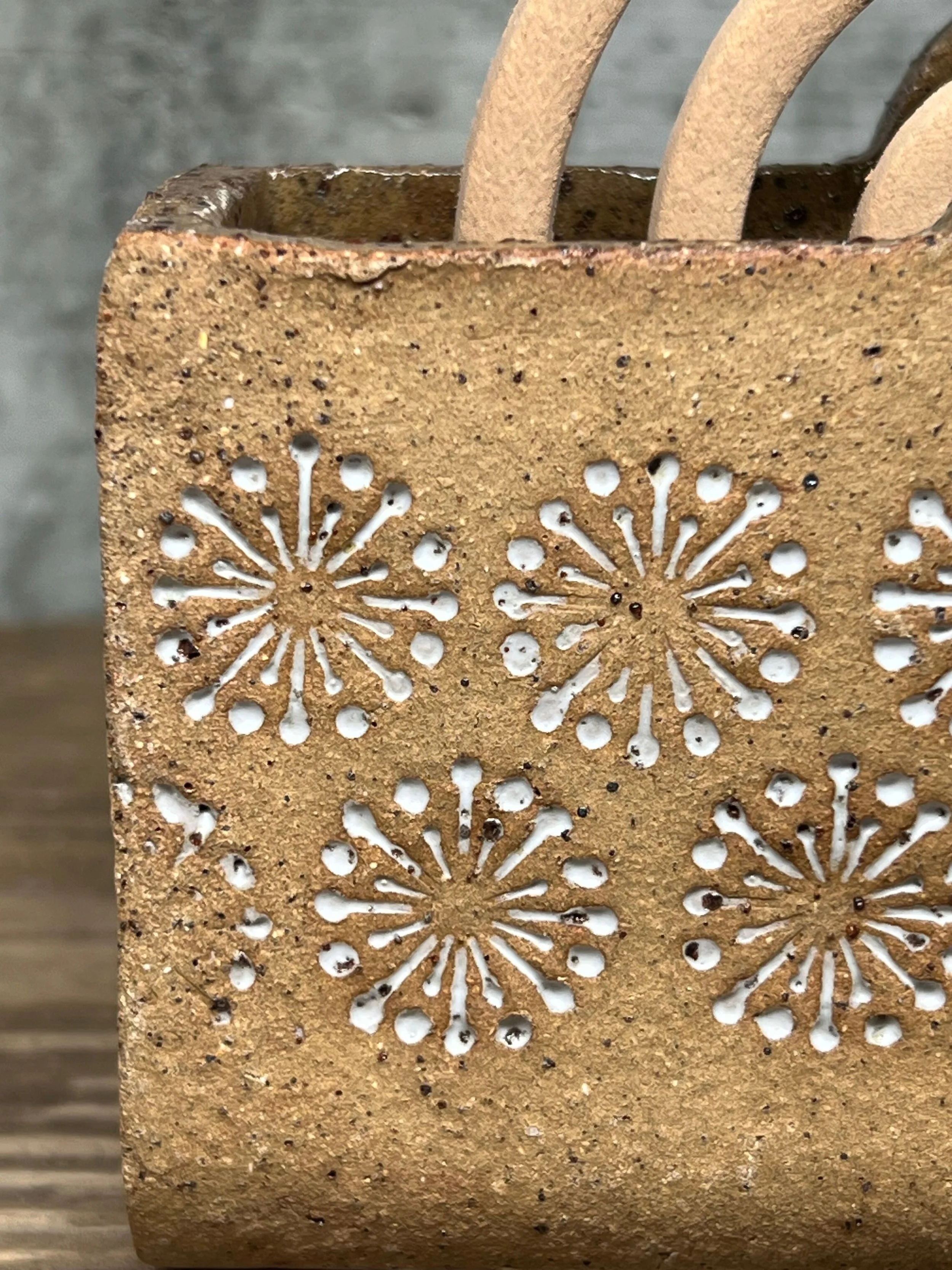 handcrafted mozzie coil holder, made from durable stoneware clay and finished with a white glaze inlay white.