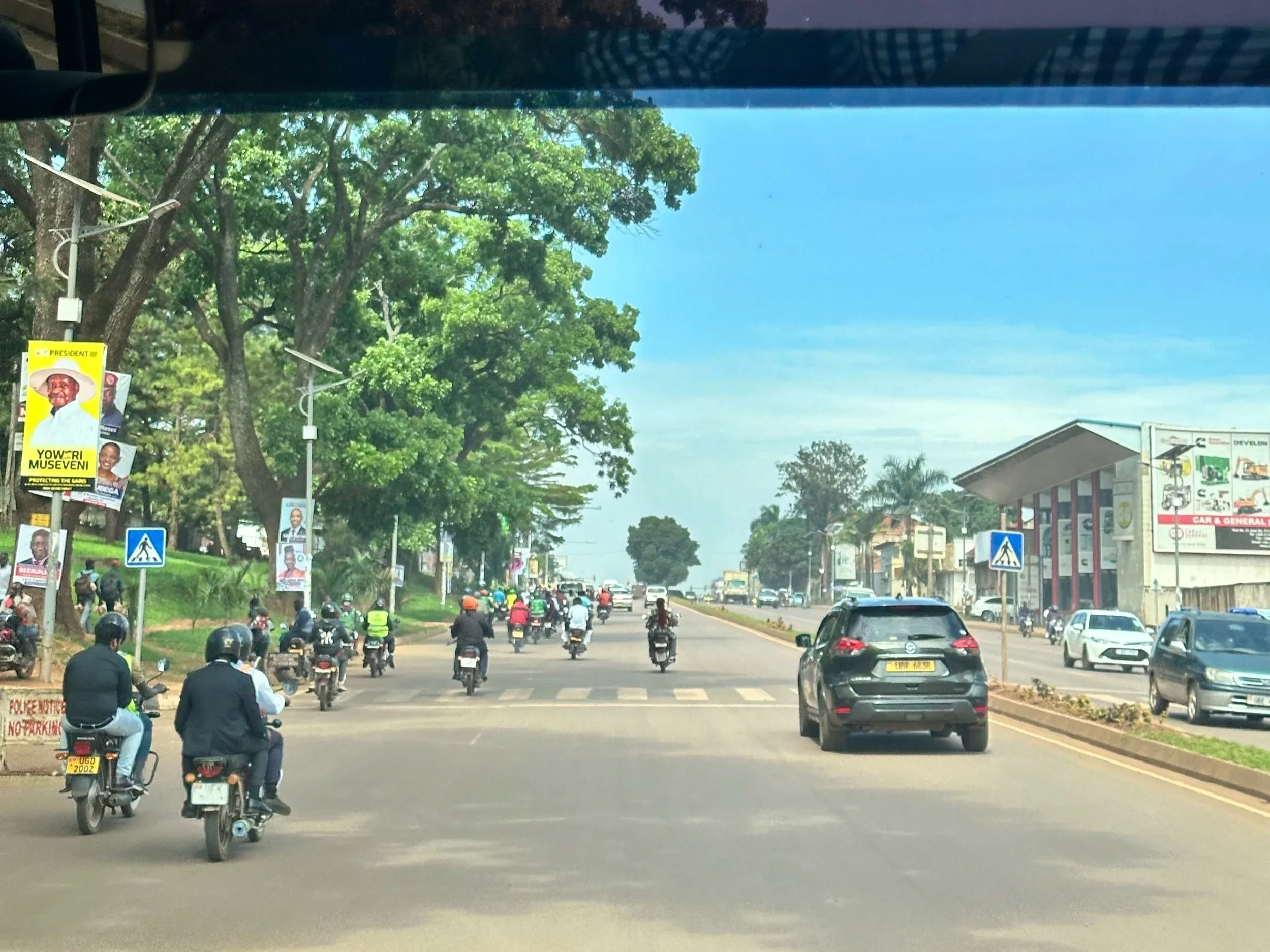Bustling metropolis of Kampala Uganda Africa, the capital city with motorcycles and boda bodas