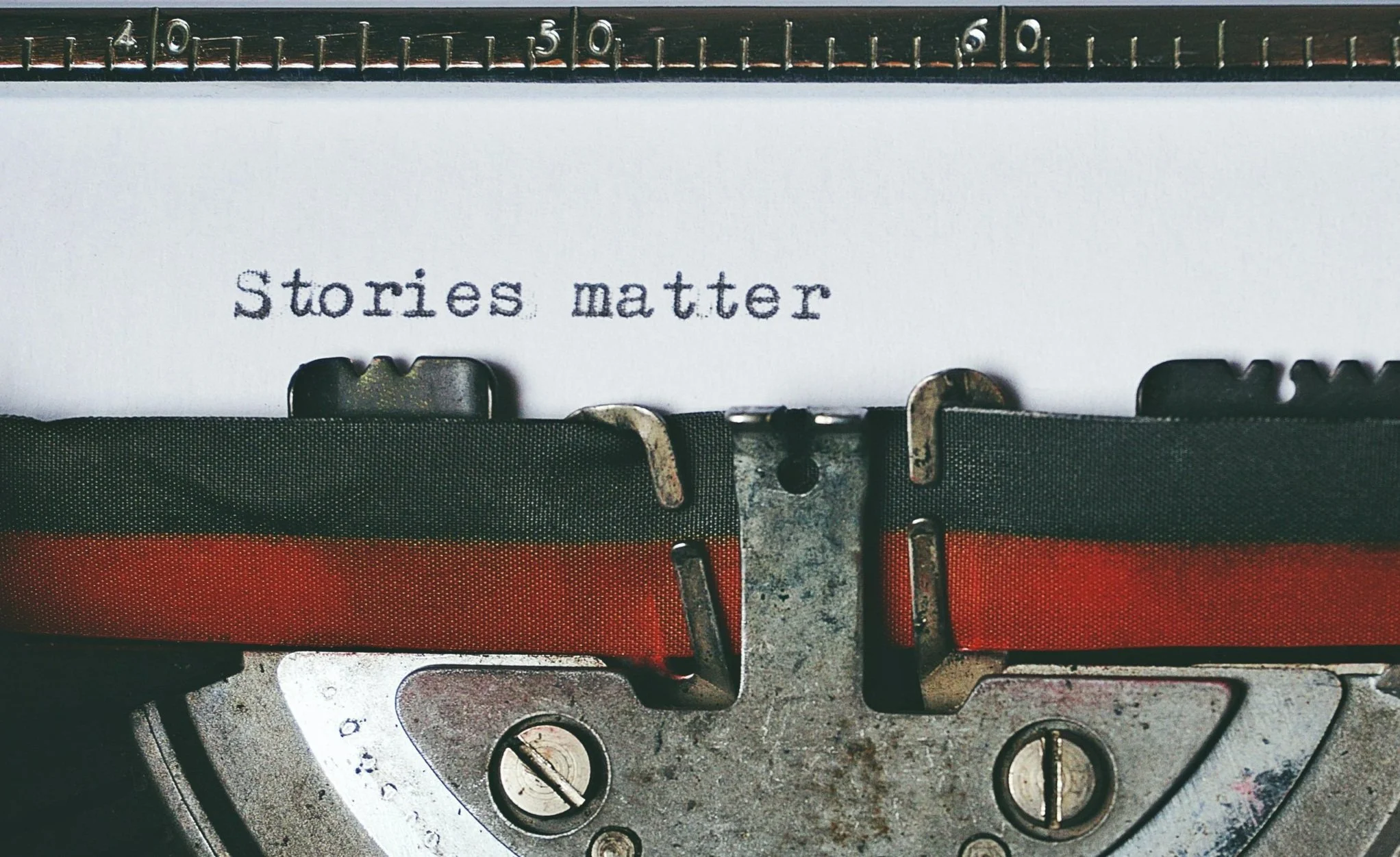Type writer with Stories Matter typed out.