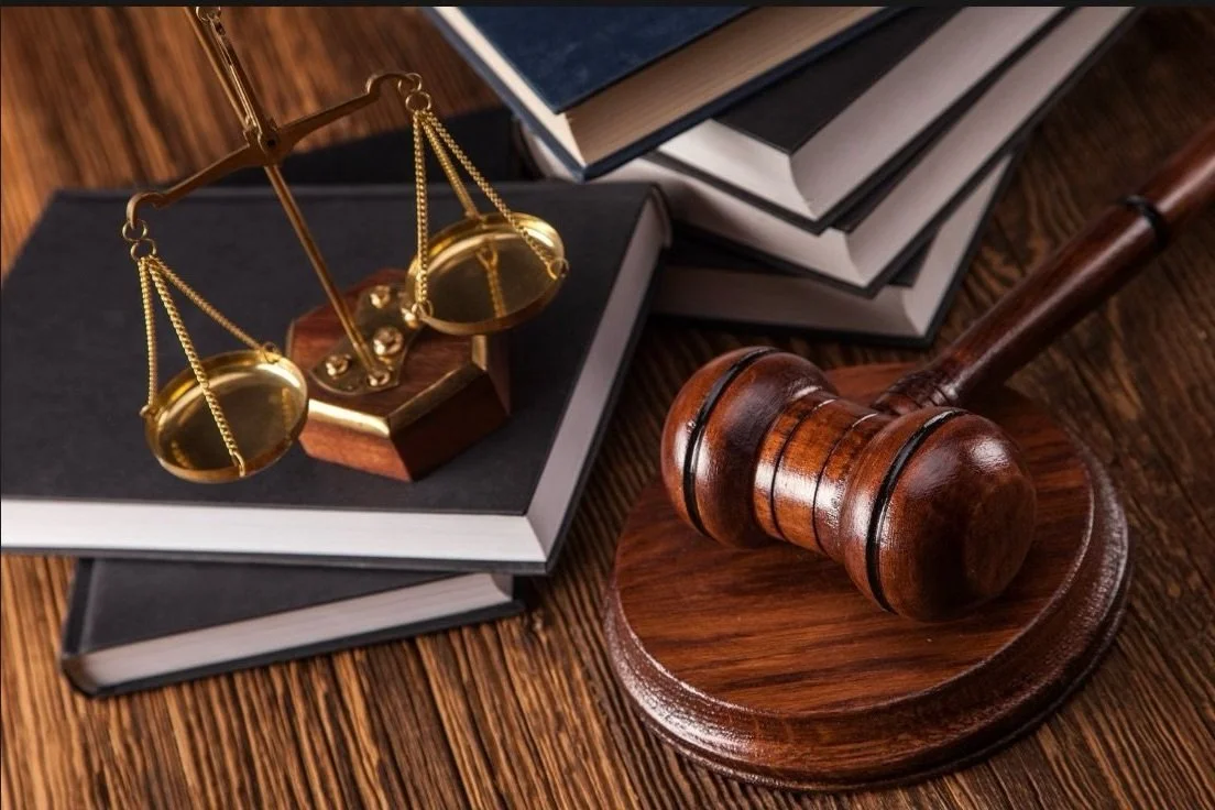 Legal scale on books with Judges gavel