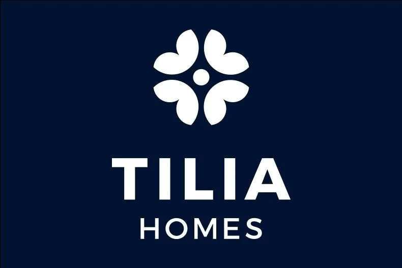 Dark blue and white Tilia Homes logo